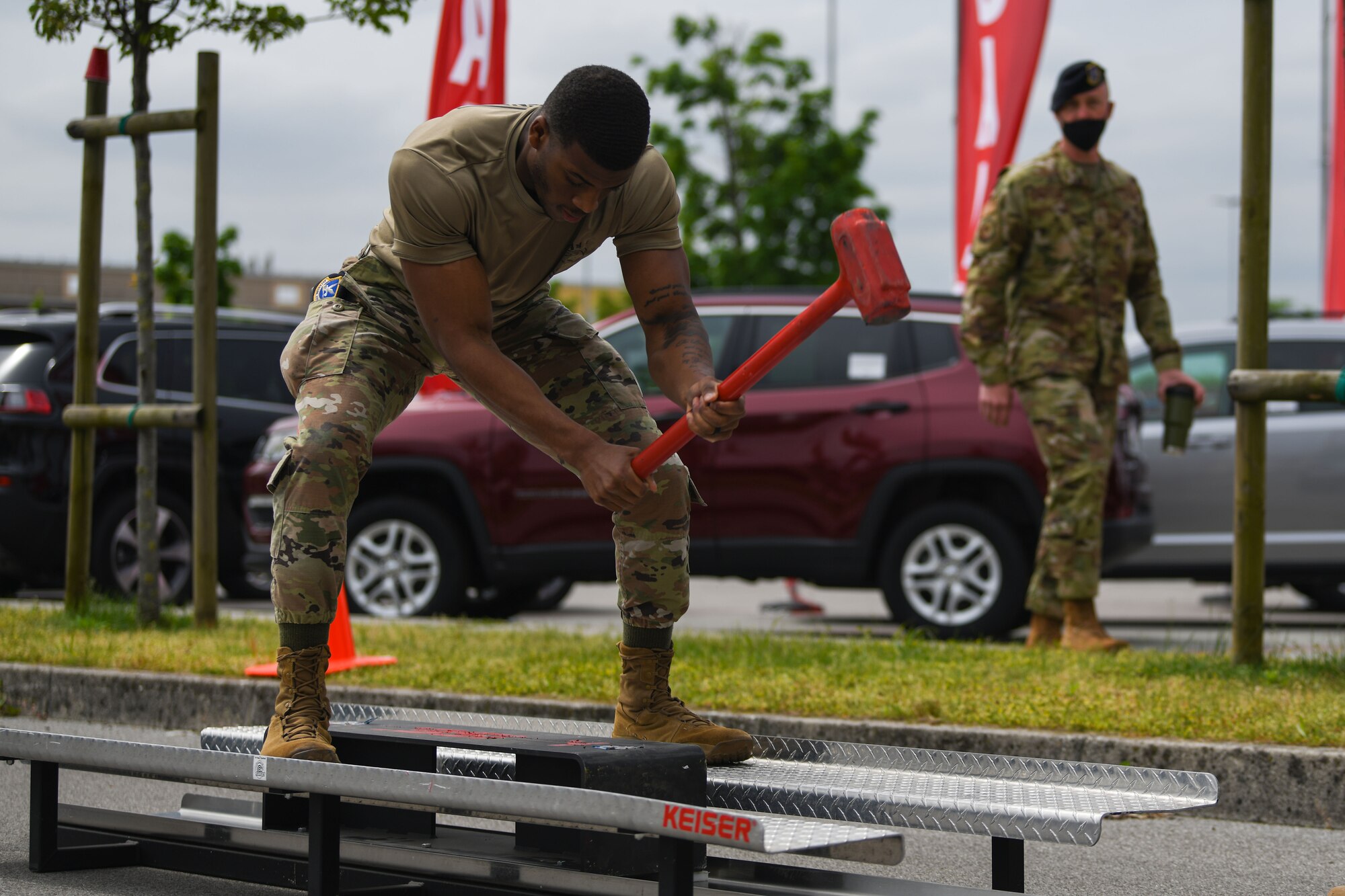Airman Jamal R. Carter, 31st Security Forces Squadron (SFS) member, uses a Keiser FORCE Machine during Police Week at Aviano Air Base, Italy, May 11, 2021. The Keiser FORCE Machine was originally designed to simulate the chopping motion used in firefighting. It employs the same kinetics and ergonomics as those used with an axe, with the benefit of a safer and resource-free training and conditioning exercise. (U.S. Air Force photo by Senior Airman Ericka A. Woolever)