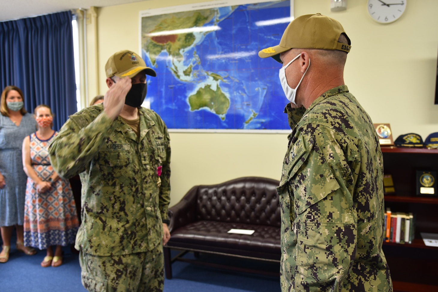 Rear Adm. Fred Kacher, left, salutes Rear Adm. Chris Engdahl, during a change of command ceremony for Expeditionary Strike Group (ESG) 7 on Naval Base White Beach. Engdahl relieved Kacher as the ESG 7 commander. ESG 7 is forward deployed in the U.S. 7th Fleet area of responsibility to enhance interoperability with allies and partners and serve as a ready response force to defend peace and stability in the Indo-Pacific region.