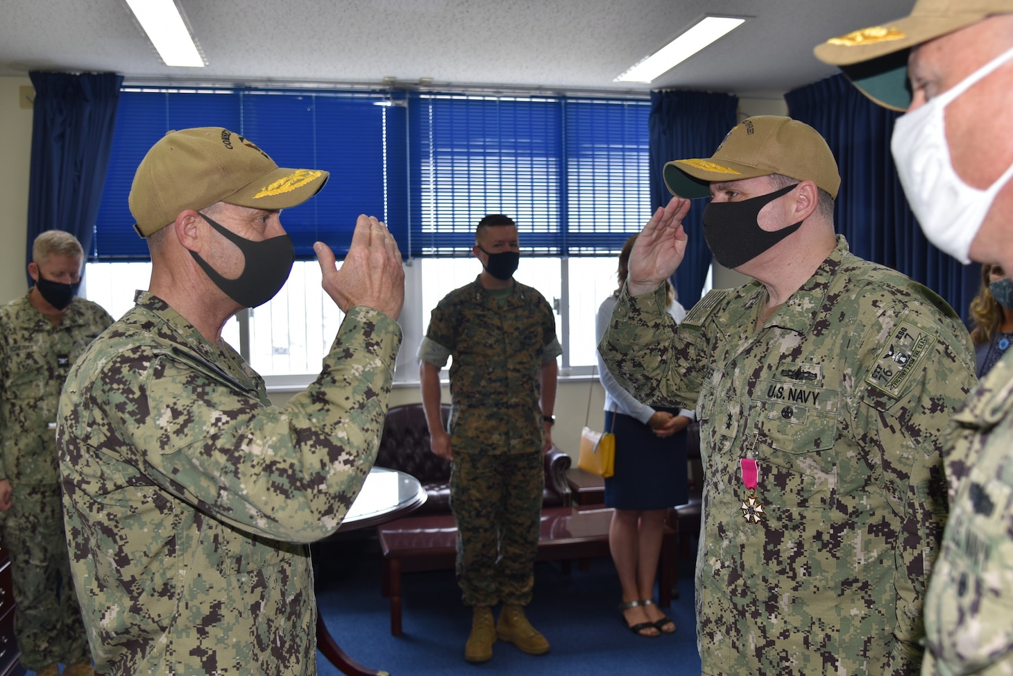 Rear Adm. Fred Kacher, salutes, Vice Adm. Bill Merz, commander, U.S. 7th Fleet, during a change of command ceremony for Expeditionary Strike Group (ESG) 7 on Naval Base White Beach. Rear Adm. Chris Engdahl relieved Kacher as ESG 7 commander. ESG 7 is forward deployed in the U.S. 7th Fleet area of responsibility to enhance interoperability with allies and partners and serve as a ready response force to defend peace and stability in the Indo-Pacific region.