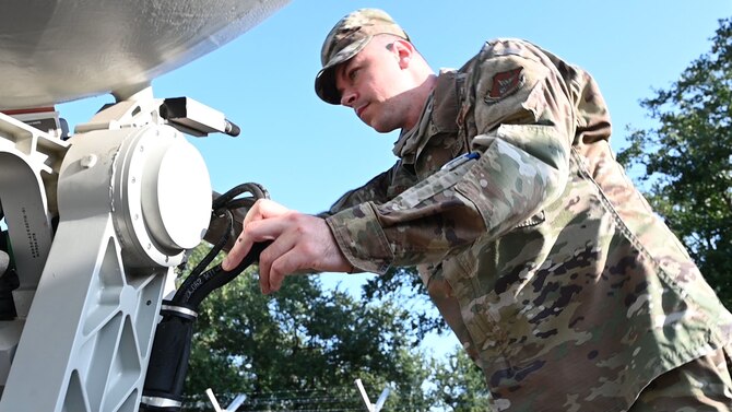 Photo of Airman working on equipment