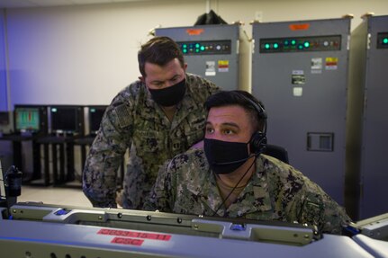 IMAGE: From left to right, Lieutenant Alexander Snazin and Ensign Marcus Banez attend the Combat Systems Officer Baseline 9 course at the AEGIS Training and Readiness Center (ATRC) in Dahlgren. The ATRC provides Sailors the tactical and technical skills required to operate, employ, and assess the readiness of the AEGIS combat systems at sea.