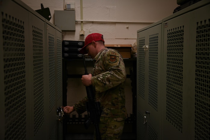 airman stores rifle in armory