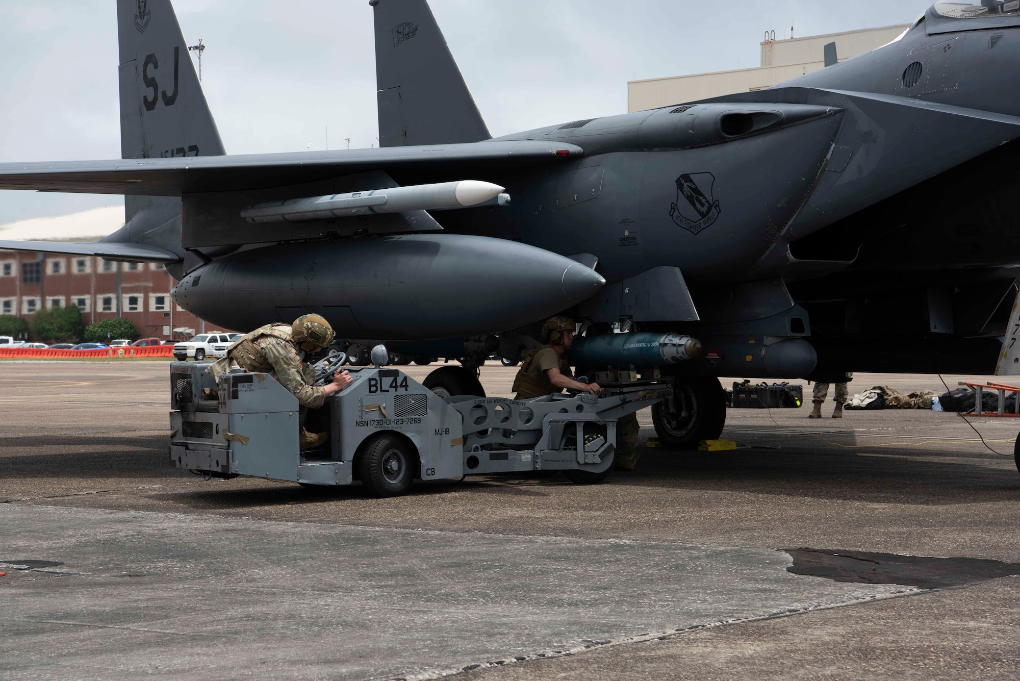 Photo of F-15 getting bomb loaded