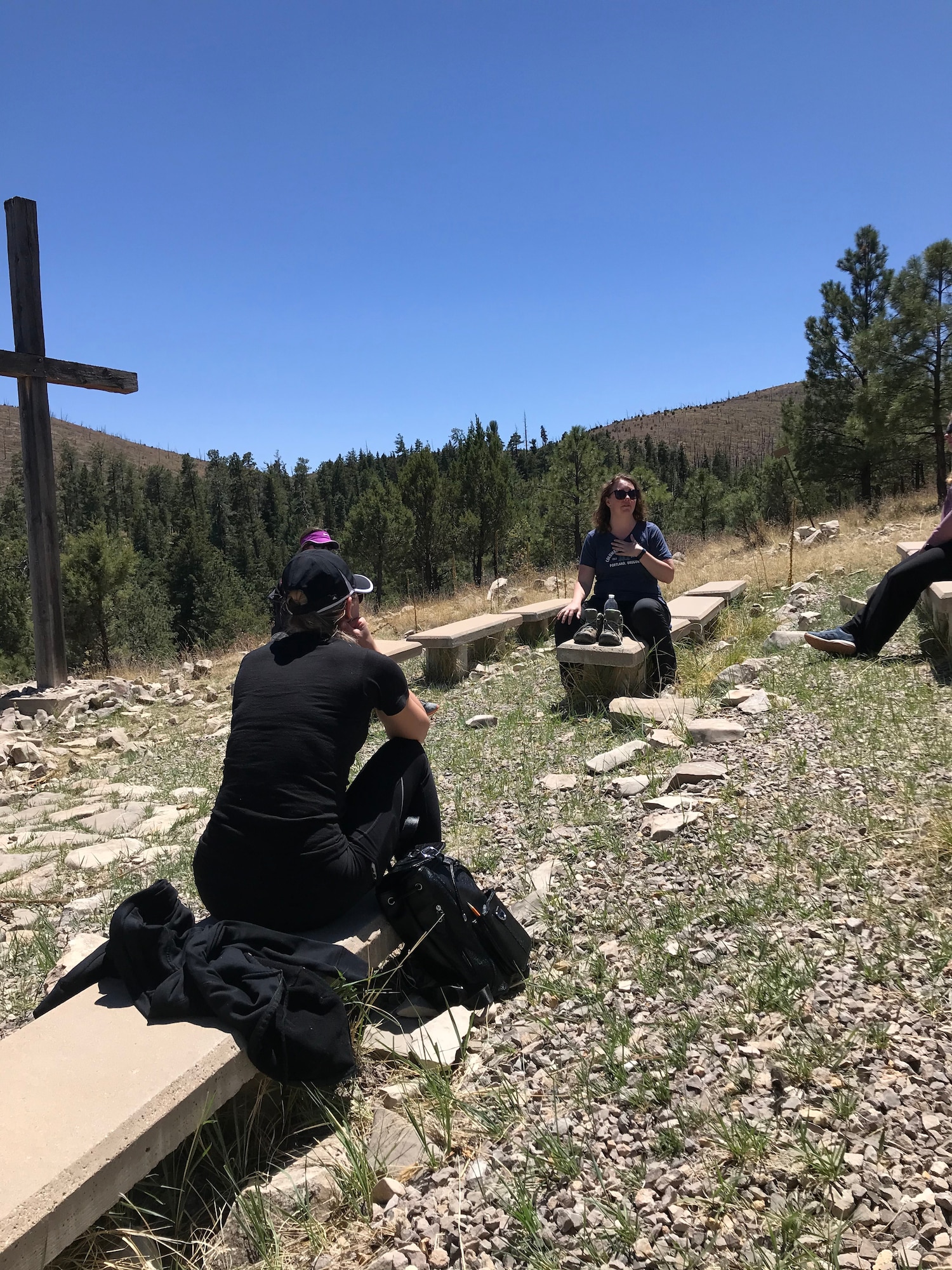 Two spouses sit across from one another and chat, May 8-9, at Sacramento Camp and Conference Center, New Mexico.