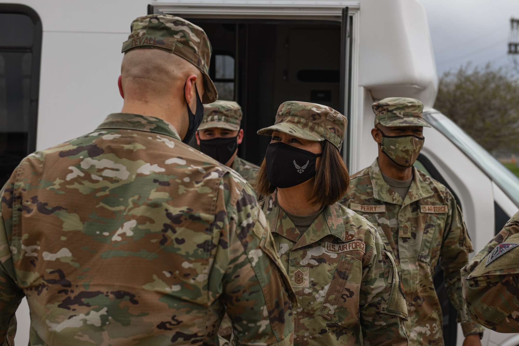 Chief Master Sgt. of the Air Force JoAnne S. Bass greets Chief Master Sgt. Robert Devall, Buckley Garrison command chief, after arriving to Buckley Air Force Base, Colo., May 7, 2021.