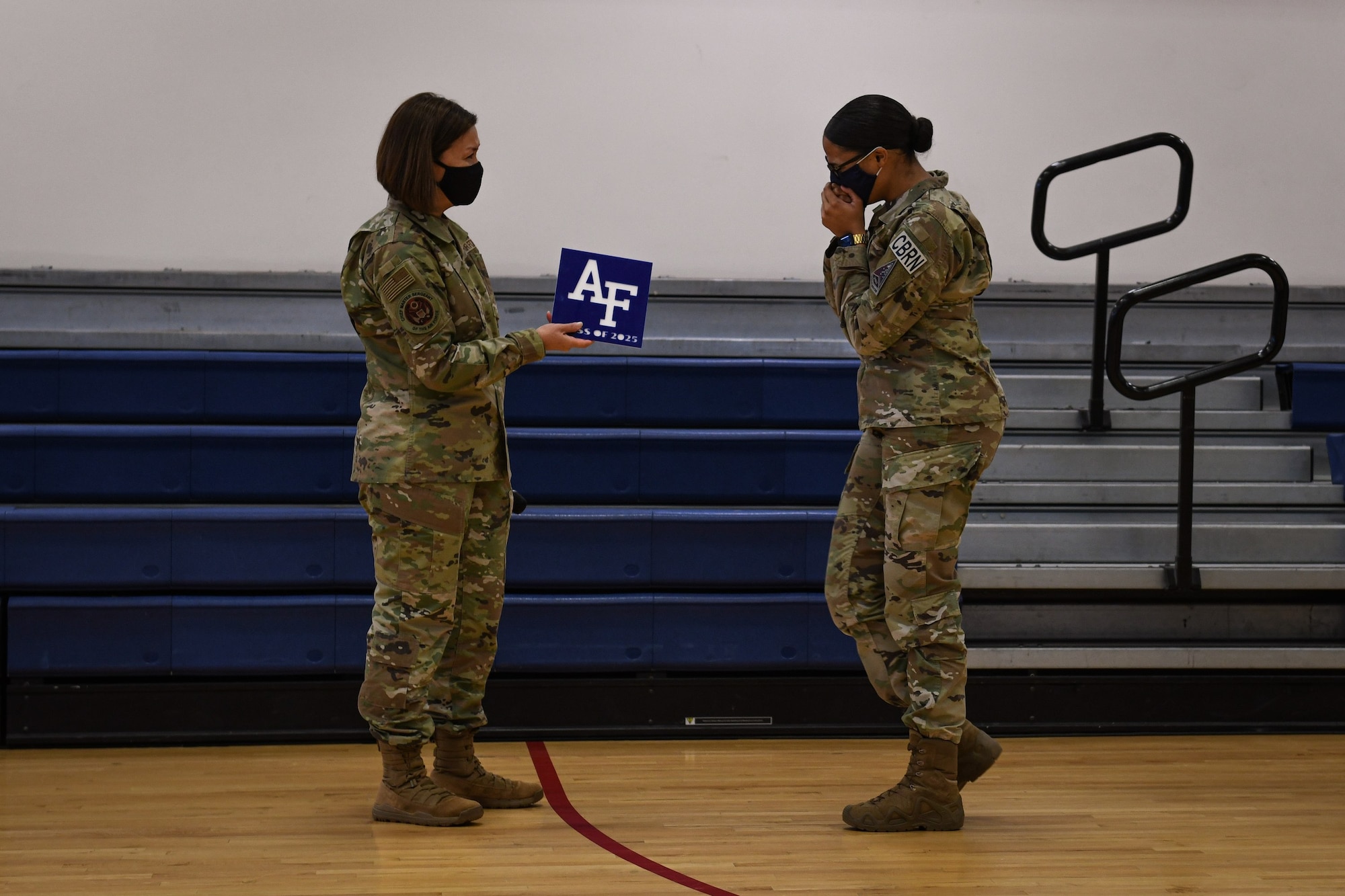 Chief Master Sgt. of the Air Force JoAnne S. Bass surprises Senior Airman Selena Little, 460th Civil Engineer Squadron emergency management apprentice, with news of her appointment into the U.S. Air Force Academy during an Enlisted All-call at Buckley Air Force Base May 7, 2021.