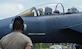 A U.S. Air Force Airman watch as the pilot of an F-15E Strike Eagle prepares to depart Naval Outlying Landing Field Choctaw, Florida, May 3, 2021. The aircraft and Airmen took part in the Agile Flag 21-2 experiment, increasing readiness and testing deployment capabilities. (U.S. Air Force photo by Senior Airman Sarah Dowe)