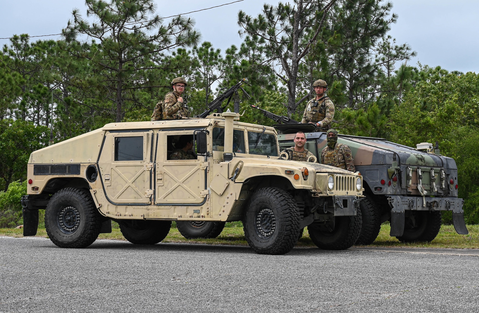 Members of the 822nd Base Defense Group, Moody Air Force Base, Georgia, perform a shift change during the Agile Flag 21-2 experiment at Naval Outlying Landing Field Choctaw, Florida, May 3, 2021. The primary mission of the 822nd BDS is training to deploy to different theaters. (U.S. Air Force photo by Senior Airman Sarah Dowe)