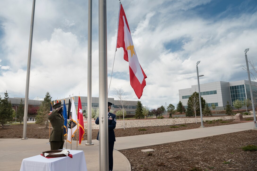 During the Gold Star flag raising ceremony May 7, United States Space Command service members ceremoniously ascend the Gold Star flag outside USSPACECOM headquarters at Peterson Air Force Base, Colorado. Gold Star families and service members from the Front Range attended the ceremony.