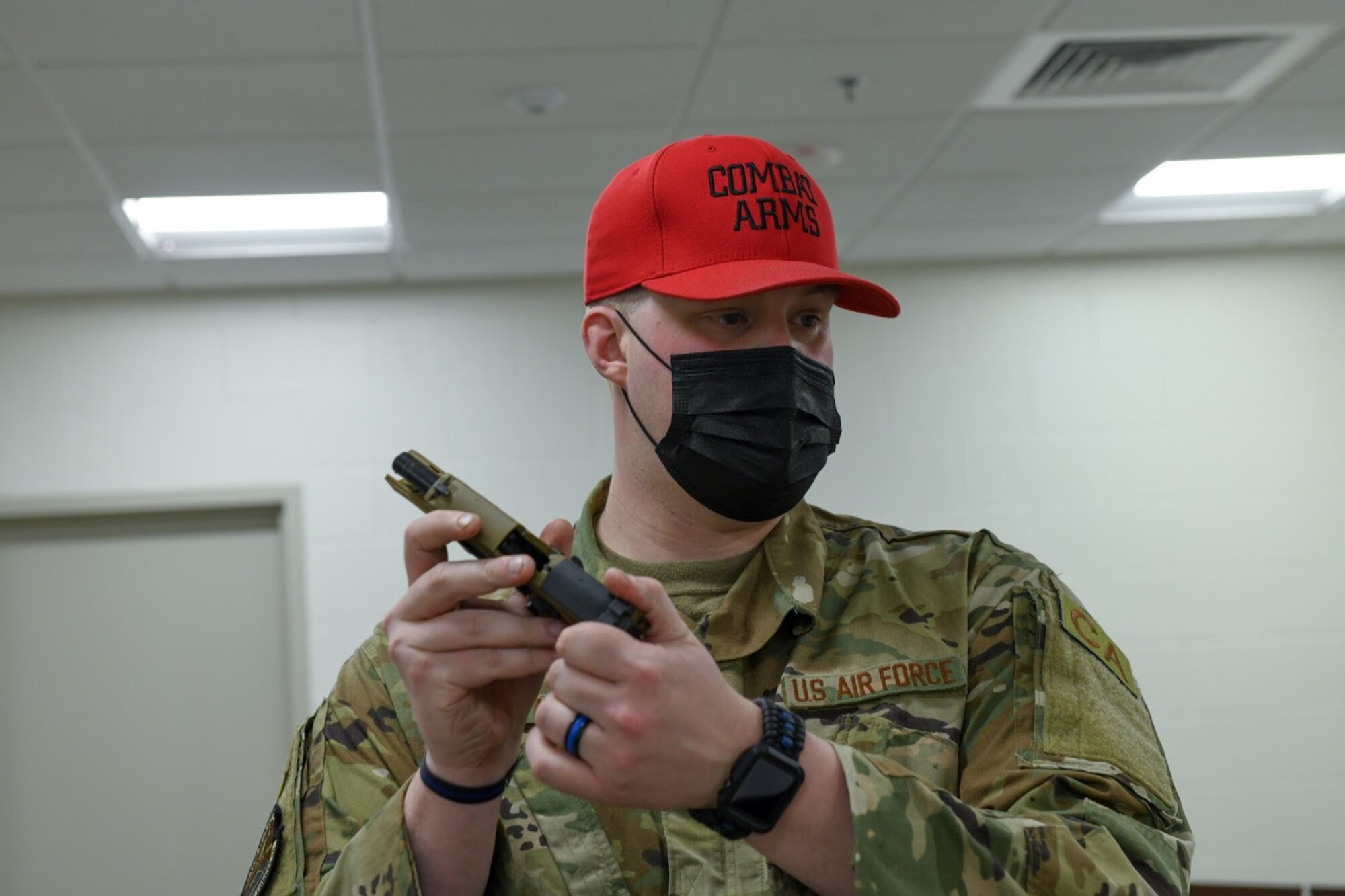 U.S. Air Force Staff Sgt. Britton Smith, the 460th Security Forces NCO in charge of combat arms, briefs the small arms competition competitors on how to operate the firearm at Buckley Air Force Base, Colo., on May 11, 2021. The operation briefing is important to prevent injury and ensure all participants are safe. (U.S. Space Force photo by Airman Shaun Combs)