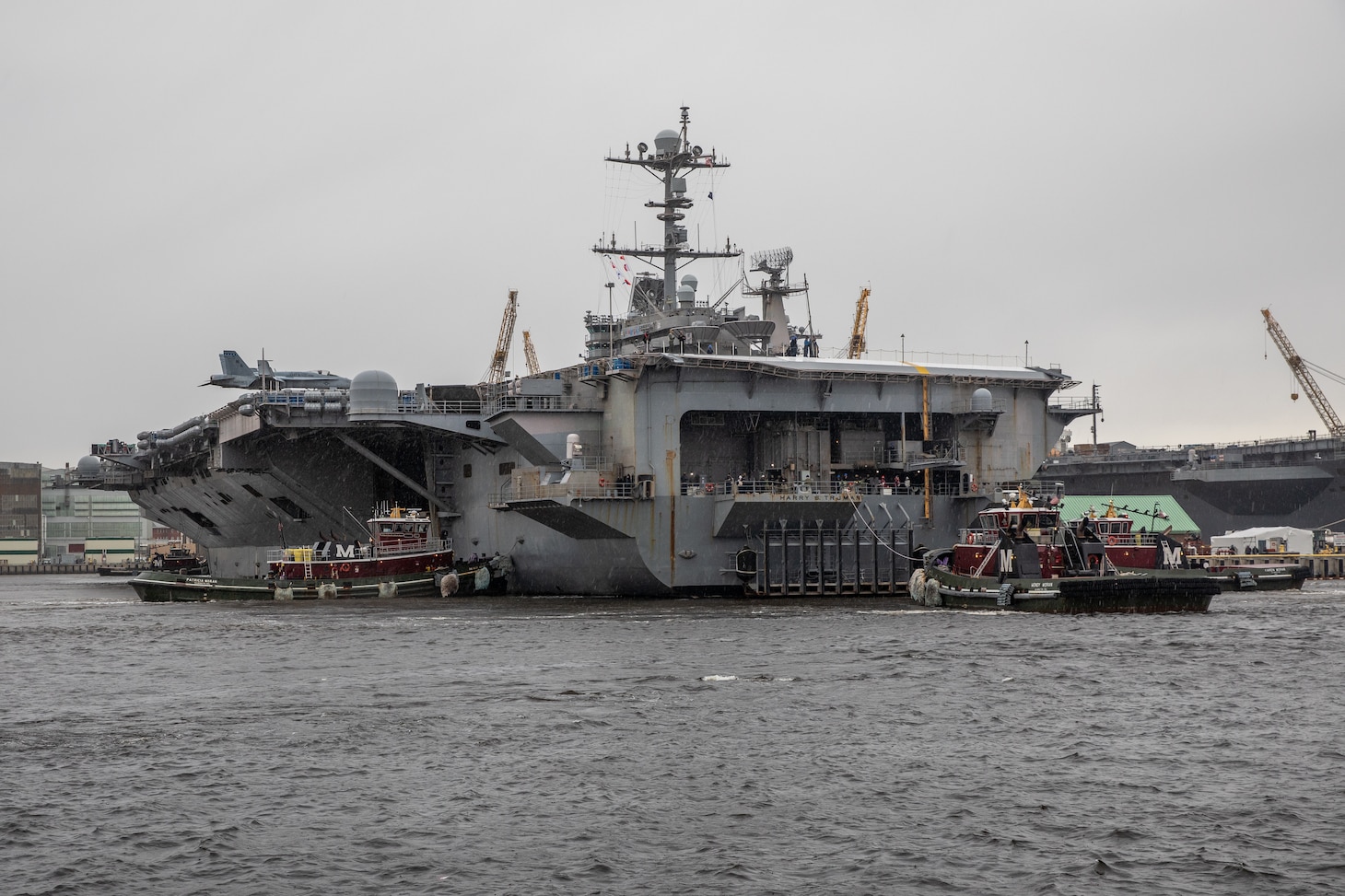 USS Harry S. Truman (CVN 75) underway to depart Norfolk Naval Shipyard (NNSY) for sea trials following completion of its Extended Carrier Incremental Availability (ECIA).