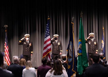 From left to right, Capt. Lincoln Reifsteck, commodore of Submarine Development Squadron 5, Cmdr. Jeremy Johnston, commanding officer of the fast-attack submarine USS Seawolf (SSN 21), and Cmdr. Jeffrey Fasssbender, prospective CO for the Seawolf, salute the ensign during the presentation of colors at a change of command ceremony in Keyport, Washington.  Crewmembers and guests of USS Seawolf attended the ceremony at the U.S. Naval Undersea Museum in Keyport, where Fassbender relieved Johnston, May 4. (U.S. Navy photo by Mass Communication Specialist 2nd Class Ian Zagrocki)