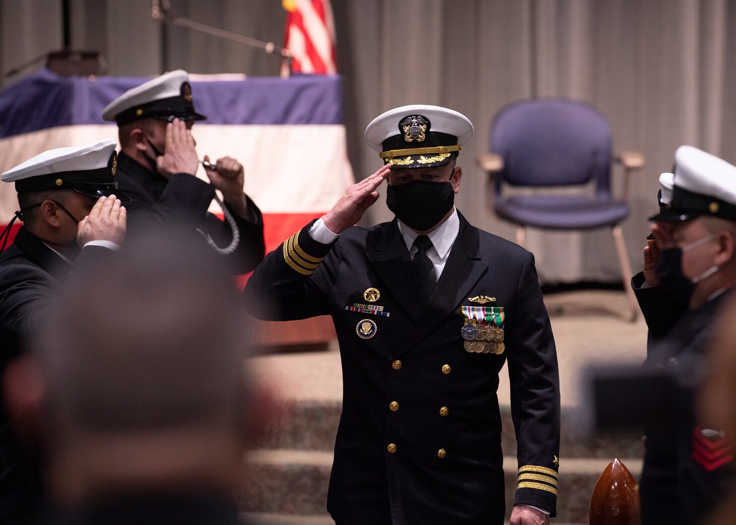 The crew of the Seawolf-class fast-attack submarine USS Seawolf (SSN 21) render honors to Cmdr. Jeffrey Fassbender, from St. Marys, Kansas, during a change of command ceremony at the U.S. Naval Undersea Museum in Keyport, Washington, May 4. During the ceremony, Fassbender relieved Cmdr. Jeremy Johnston, from Crescent, Oklahoma, as Seawolf’s commanding officer. (U.S. Navy photo by Mass Communication Specialist 2nd Class Ian Zagrocki)