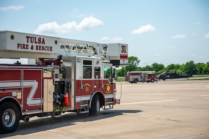 Vehicles from the Tulsa, Oklahoma Fire Department arrive on the scene of a simulated UH-60 Black Hawk crash during pre-accident training at the Oklahoma Army National Guard's Army Aviation Facility 2 in Tulsa, Oklahoma, May 12, 2021. Pre-accident training prepares Army aviation units to respond to accidents ranging from slip and falls to mass casualty events. (Oklahoma National Guard photo by Anthony Jones)