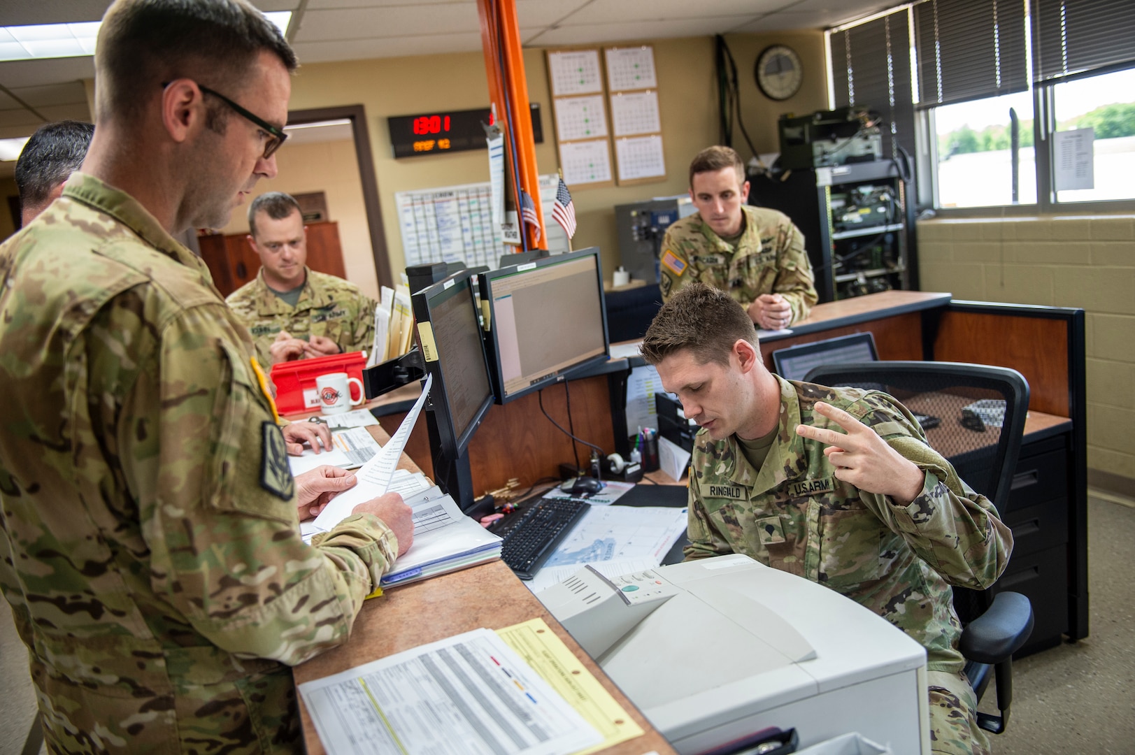 Spc. Eric Ringwald, an aviation operations specialist from Luther, Oklahoma, briefs officers from the Oklahoma Army National Guard during pre-accident training at the Oklahoma Army National Guard's Army Aviation Facility 2, in Tulsa, Oklahoma, May 12, 2021. Pre-accident training prepares Army aviation units to respond to accidents ranging from slip and falls to mass casualty events. (Oklahoma National Guard photo by Anthony Jones)