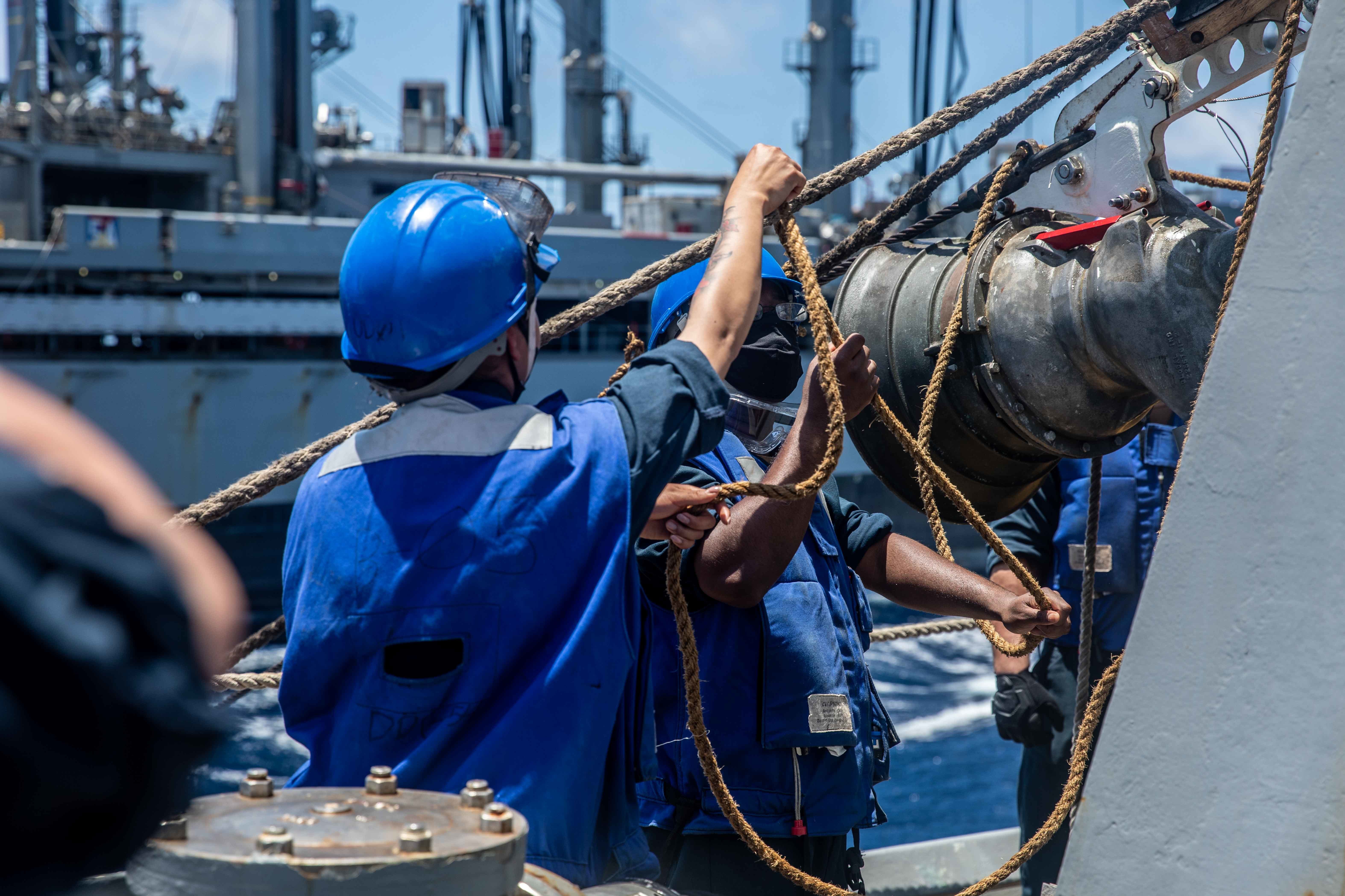 USS Curtis Wilbur (DDG 54) conducts a replenishment-at-sea with the Henry J. Kaiser-class fleet replenishment oiler USNS Big Horn (T-AO 198).
