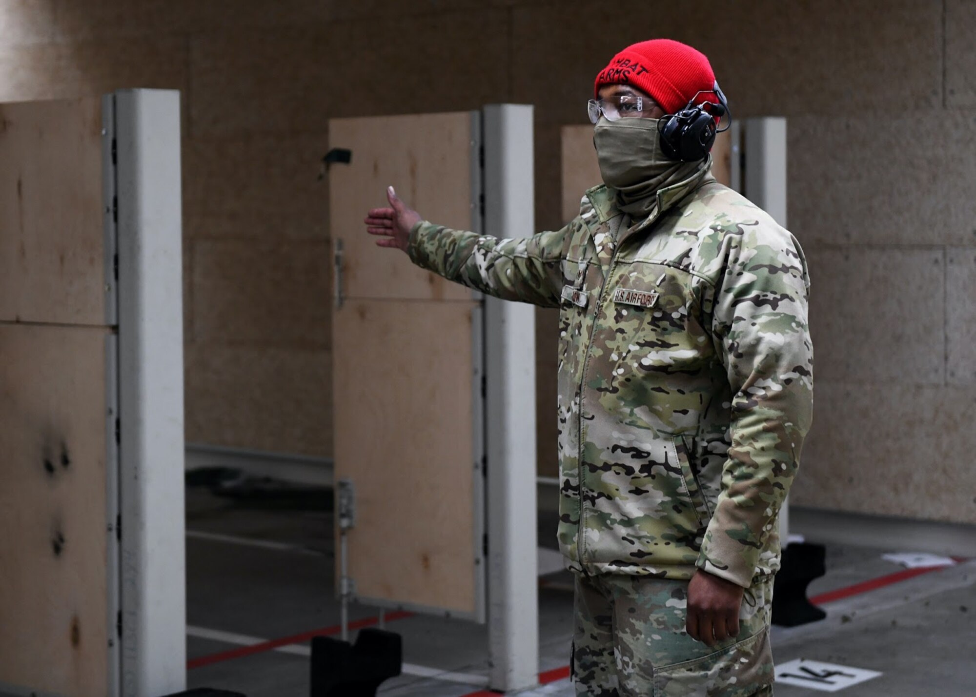 U.S. Air Force Staff Sgt. William Brown, 460th Security Forces Squadron combat arms instructor, signals that the shooting bays are ready at a shooting competition on Buckley Air Force Base, Colo., May 11, 2021. The 460th SFS Combat Arms team held a shooting competition in honor of National Police Week. The competition gives a chance for the top 10% of shooters to receive an Excellence in Competition shooting badge. (U.S. Space Force photo by Airman 1st Class Haley N. Blevins)