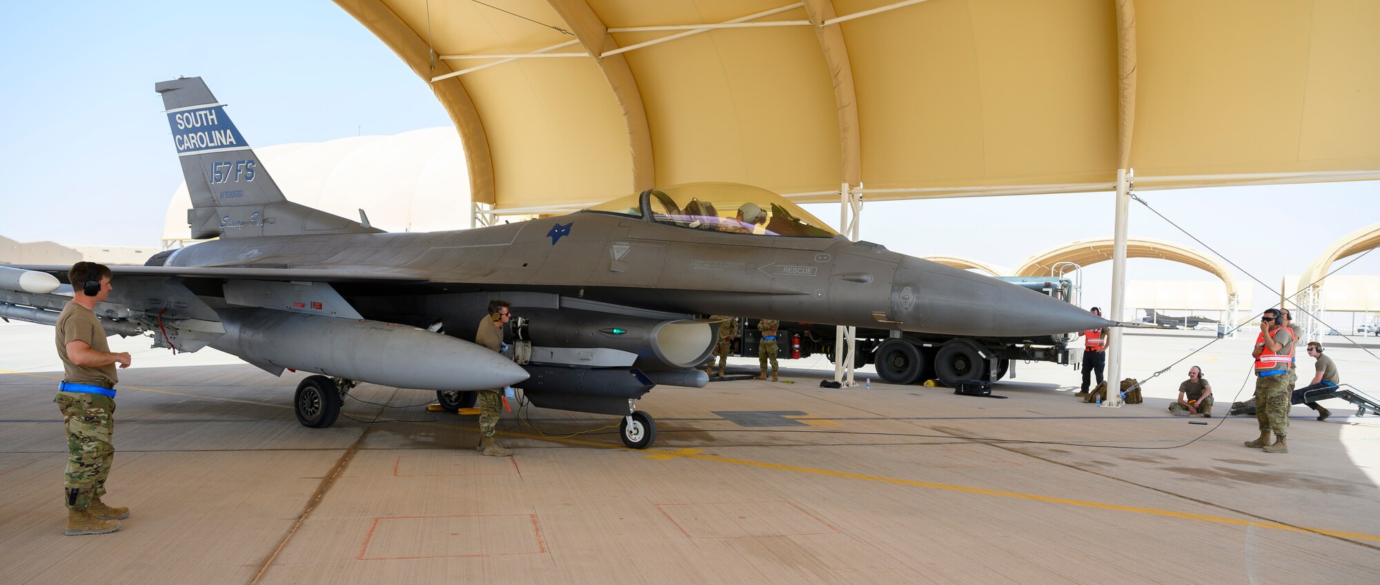 Members of the 379th Expeditionary Maintenance Squadron perform a “hot pit” refueling under the supervision of 378th Expeditionary Operations Group training instructors, Prince Sultan Air Base, Kingdom of Saudi Arabia, May 3, 2021. Hot pit refueling is where maintainers refuel an aircraft while the engine is still running, allowing the aircraft to safely and quickly return to flying. (U.S. Air Force Photo by Senior Airman Samuel Earick)