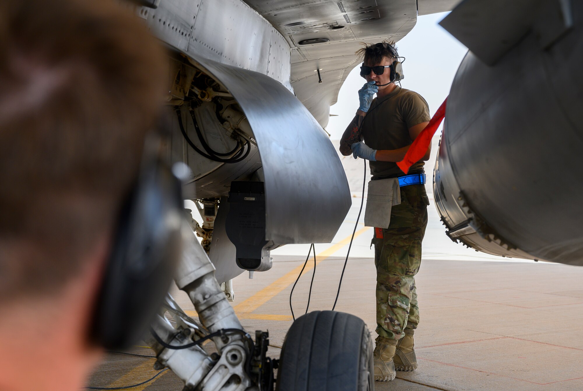 Senior Airman Shane Brennan, 379th Expeditionary Maintenance Squadron C-130 crew chief, performs a “hot pit” refueling, Prince Sultan Air Base, Kingdom of Saudi Arabia, May 3, 2021. Hot pit refueling is where maintainers refuel an aircraft while the engine is still running, allowing the aircraft to safely and quickly return to flying. (U.S. Air Force Photo by Senior Airman Samuel Earick)