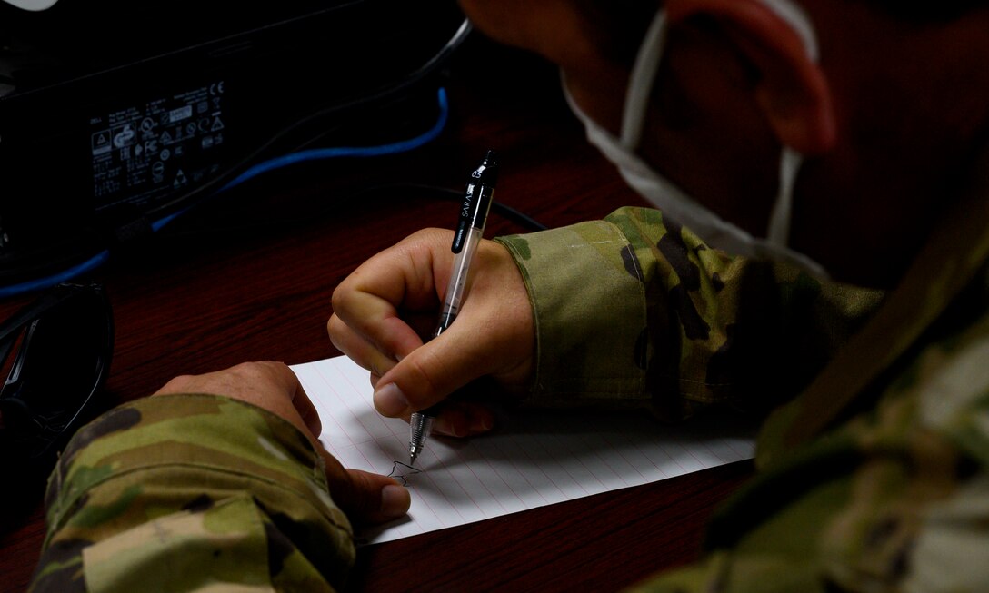 Master Sgt. Anthony Cox, 379th Expeditionary Maintenance Squadron team lead, draws a diagram of a U.S. Air Force F-16 during the classroom portion of “hot pit” refueling training, Prince Sultan Air Base, Kingdom of Saudi Arabia, April 28, 2021. Hot pit refueling is where maintainers refuel an aircraft while the engine is still running, allowing the aircraft to safely and quickly return to flying. (U.S. Air Force Photo by Senior Airman Samuel Earick)
