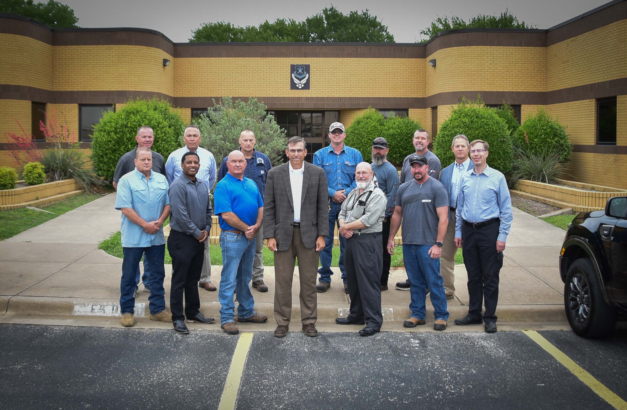 301st Fighter Wing Base Civil Engineers stand in front of the wing's civil engineer squadron building at U.S. Naval Air Station Joint Reserve Base Fort Worth, Texas on March 10, 2021. BCE consists of 17 people from across two sections—engineering and operations. They currently support the installation, the 301 FW's F-16 Fighting Falcon mission and are preparing for the wing's new mission as the Air Force Reserve Command's first F-35A Lightning II unit. (U.S. Air Force photo by Senior Airman William Downs)