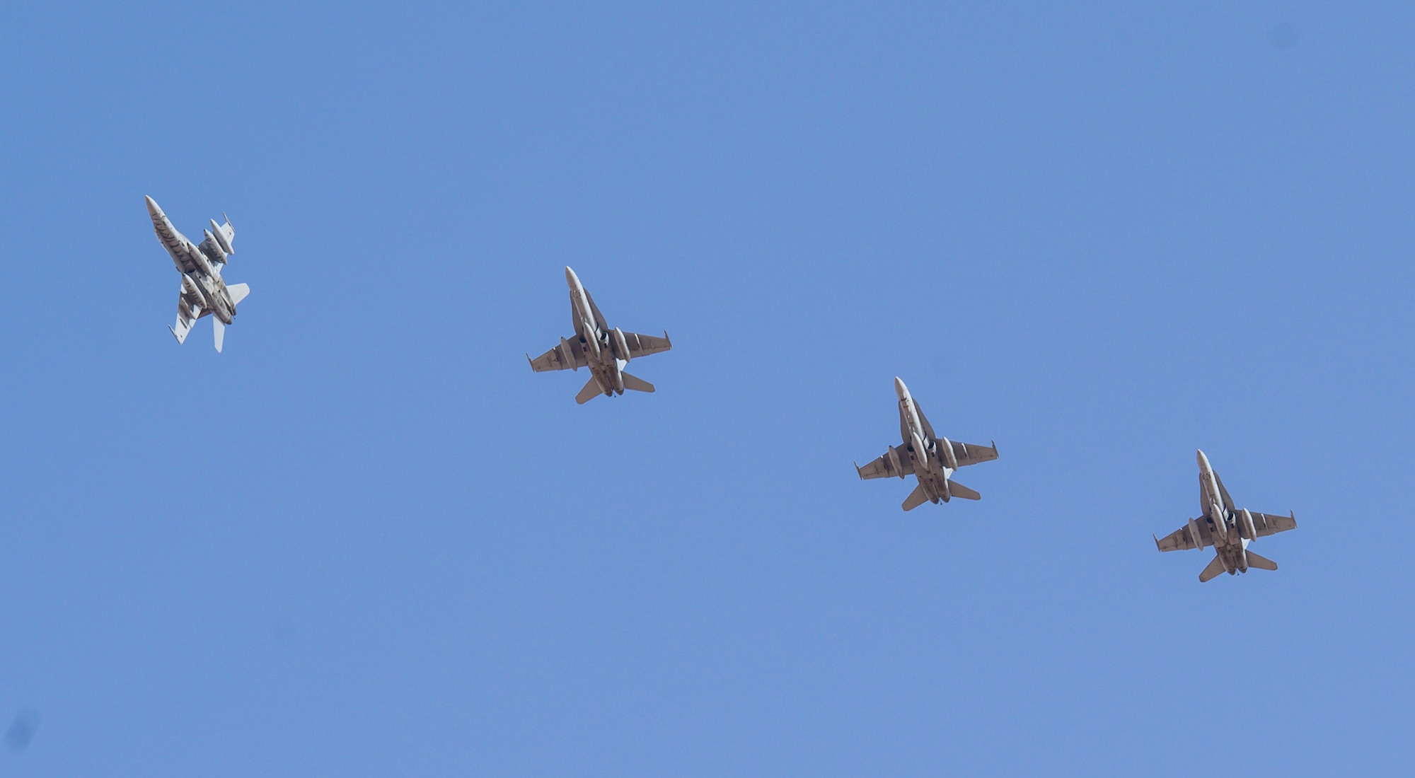 A U.S. Marine Corps F/A-18D Hornet banks away from formation in preparation for landing at Prince Sultan Air Base, Kingdom of Saudi Arabia, May 8, 2021. A detachment of F/A-18s, along with squadron personnel from Marine Corps Air Station Beaufort, South Carolina, will rapidly integrate into theater training, as well as joint and partnered missions, as part of a dynamic force employment highlighting the U.S. military’s ability to rapidly deploy and employ forces anywhere around the globe. (U.S. Air Force photo by Senior Airman Samuel Earick)