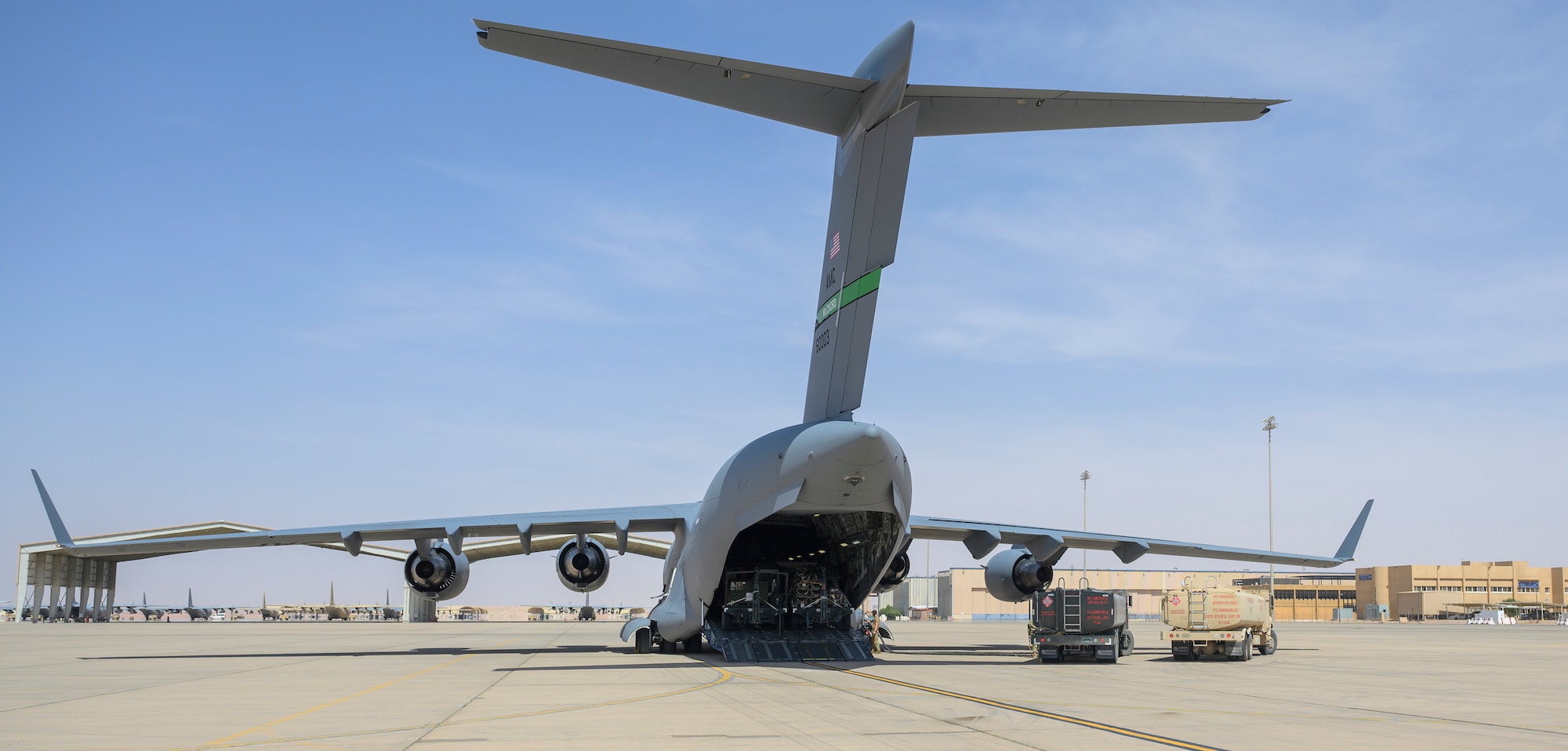 Personnel from the 378th Expeditionary Logistics Readiness Squadron refuel a U.S. Air Force C-17 carrying cargo from Marine Corps Air Station Beaufort, South Carolina, after it landed at Prince Sultan Air Base, Kingdom of Saudi Arabia, May 5, 2021. Personnel, aircraft, and supplies from Marine All Weather Fighter Attack Squadron 224, Marine Aircraft Group 31, deployed as part of a dynamic force employment to PSAB to enhance U.S. Central Command’s ability to deter aggression and promote security and stability within the USCENTCOM area of responsibility. (U.S. Air Force photo by Senior Airman Samuel Earick)