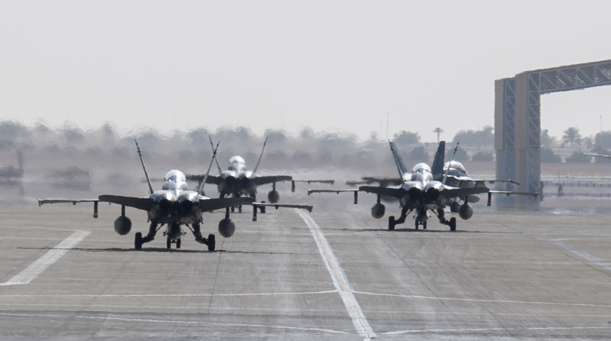 U.S. Marine Corps F/A-18D Hornets taxi to their parking spots at Prince Sultan Air Base, Kingdom of Saudi Arabia, May 8, 2021. A detachment of F/A-18s, along with squadron personnel from Marine Corps Air Station Beaufort, South Carolina, will rapidly integrate into theater training, as well as joint and partnered missions, as part of a dynamic force employment highlighting the U.S. military’s ability to rapidly deploy and employ forces anywhere around the globe.  (U.S. Air Force photo by Senior Airman Samuel Earick)
