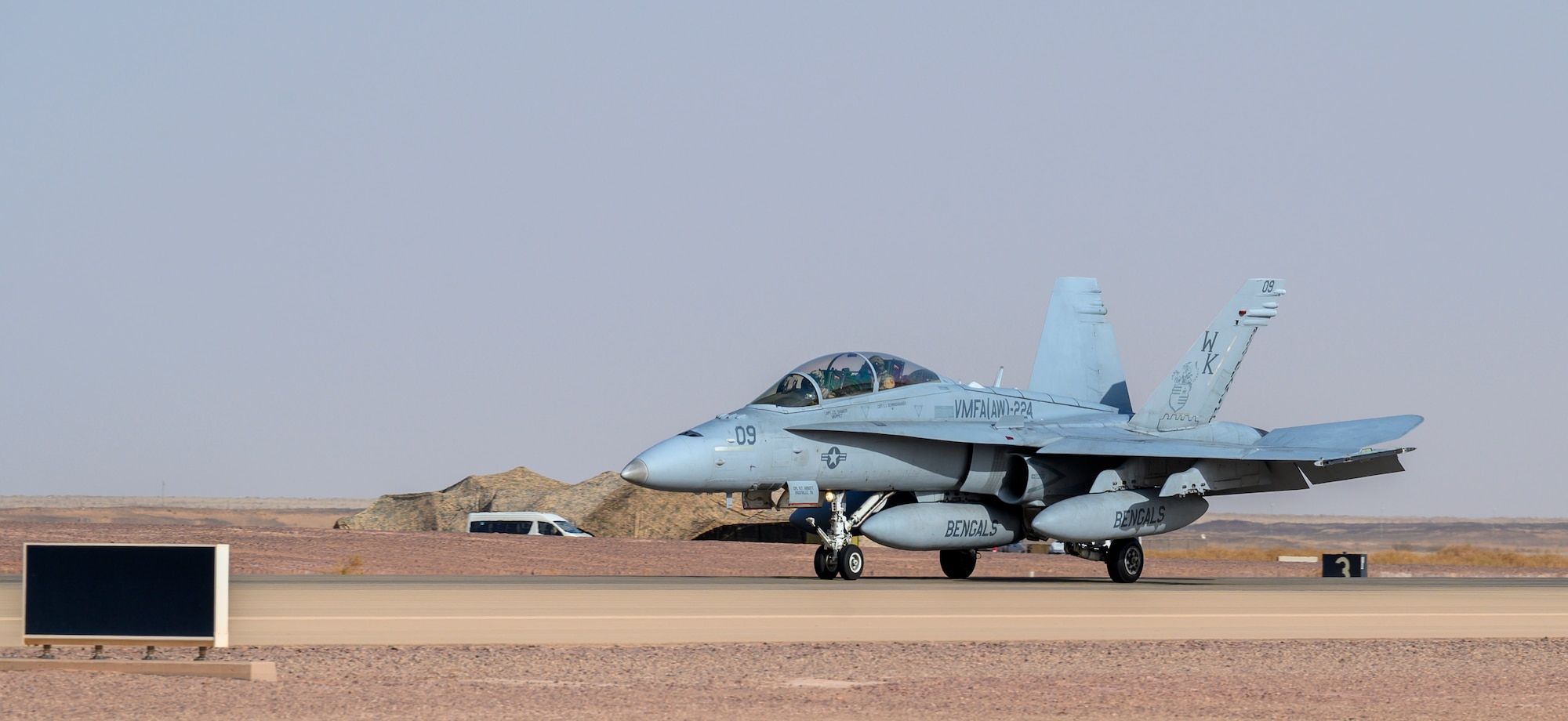 A U.S. Marine Corps F/A-18D Hornet lands on the flightline at Prince Sultan Air Base, Kingdom of Saudi Arabia, May 8, 2021. Personnel, aircraft, and supplies from Marine All Weather Fighter Attack Squadron 224, Marine Aircraft Group 31, deployed to PSAB from Marine Corps Air Station Beaufort, South Carolina, as part of a dynamic force employment to enhance U.S. Central Command’s ability to deter aggression and promote security and stability within the USCENTCOM area of responsibility. (U.S. Air Force photo by Senior Airman Samuel Earick)