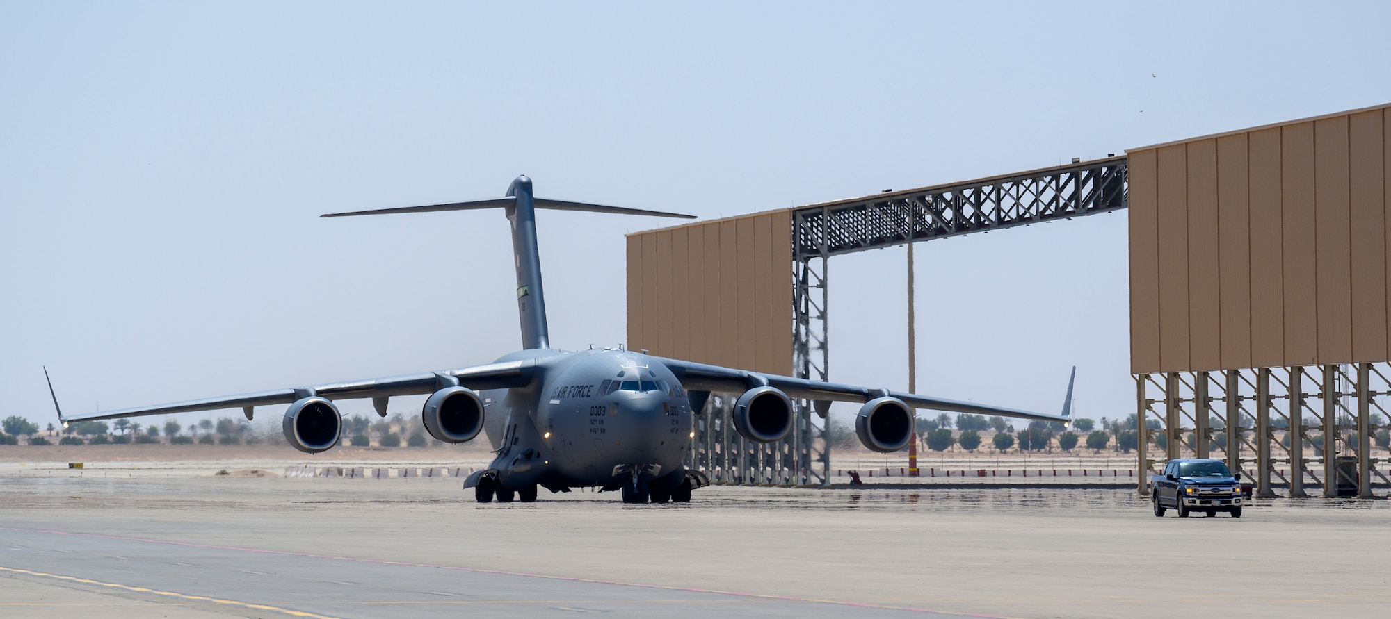 A U.S. Air Force C-17 carrying cargo from Marine Corps Air Station Beaufort, South Carolina, taxis on the flightline at Prince Sultan Air Base, Kingdom of Saudi Arabia, May 5, 2021. Personnel, aircraft, and supplies from Marine All Weather Fighter Attack Squadron 224, Marine Aircraft Group 31, deployed as part of a dynamic force employment to PSAB to enhance U.S. Central Command’s ability to deter aggression and promote security and stability within the USCENTCOM area of responsibility. (U.S. Air Force photo by Senior Airman Samuel Earick)