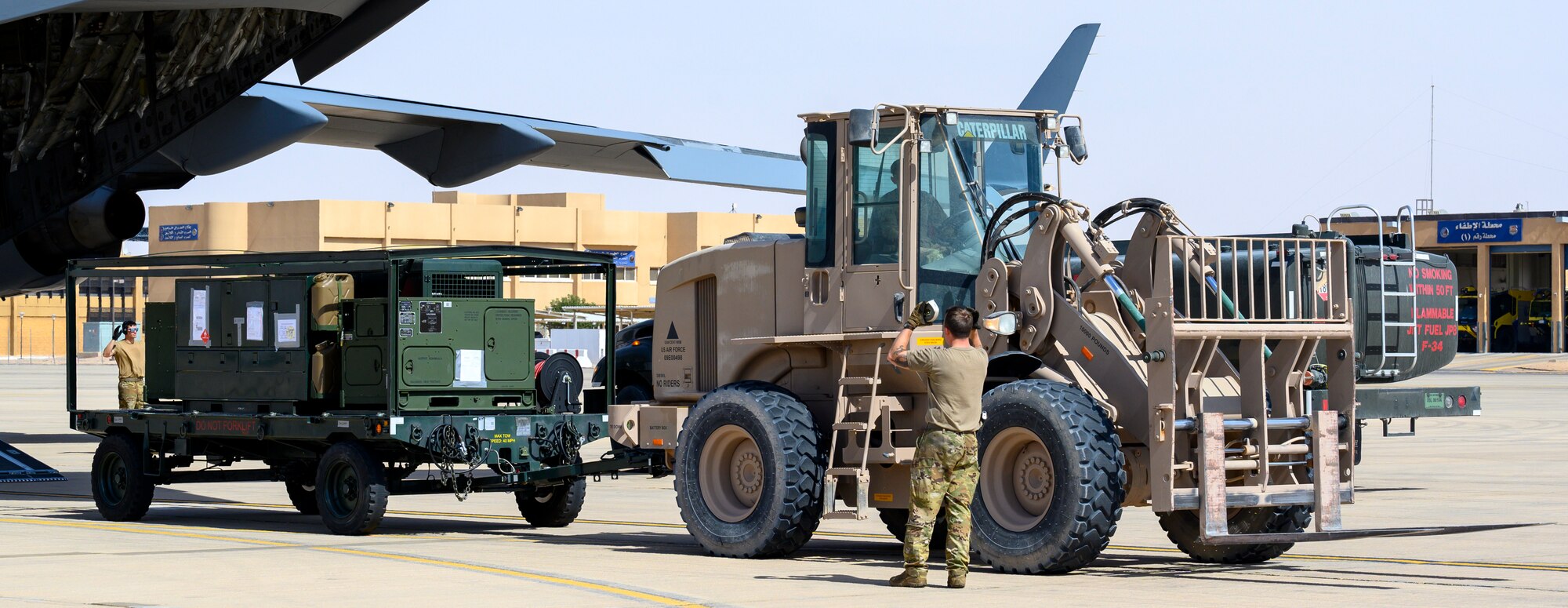 Members of the 378th Expeditionary Logistics Readiness Squadron Air Terminal Operations Center unload supplies from a U.S. Air Force C-17 at Prince Sultan Air Base, Kingdom of Saudi Arabia, May 5, 2021. Personnel, aircraft, and supplies from Marine All Weather Fighter Attack Squadron 224, Marine Aircraft Group 31, deployed as part of a dynamic force employment to PSAB from Marine Corps Air Station Beaufort, South Carolina, to enhance U.S. Central Command’s ability to deter aggression and promote security and stability within the USCENTCOM area of responsibility. (U.S. Air Force photo by Senior Airman Samuel Earick)