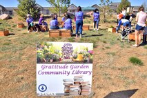 People engaging with the community garden at Schriever Air Force Base.