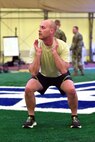 Member completes an air squat