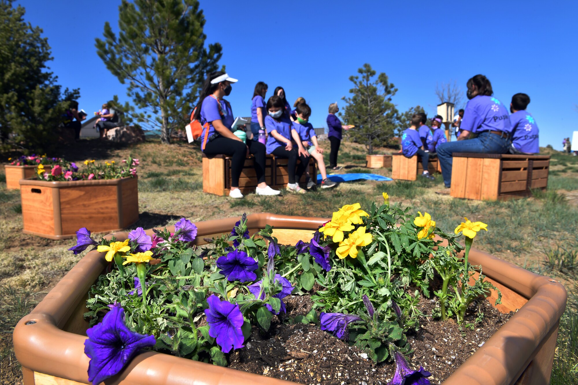 People engaging with the community garden at Schriever Air Force Base