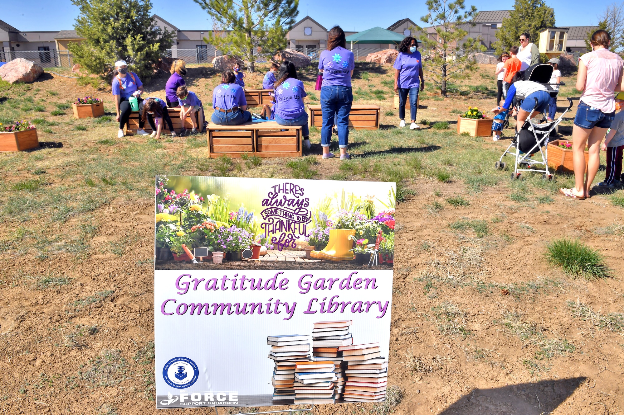 People engaging with the community garden at Schriever Air Force Base.