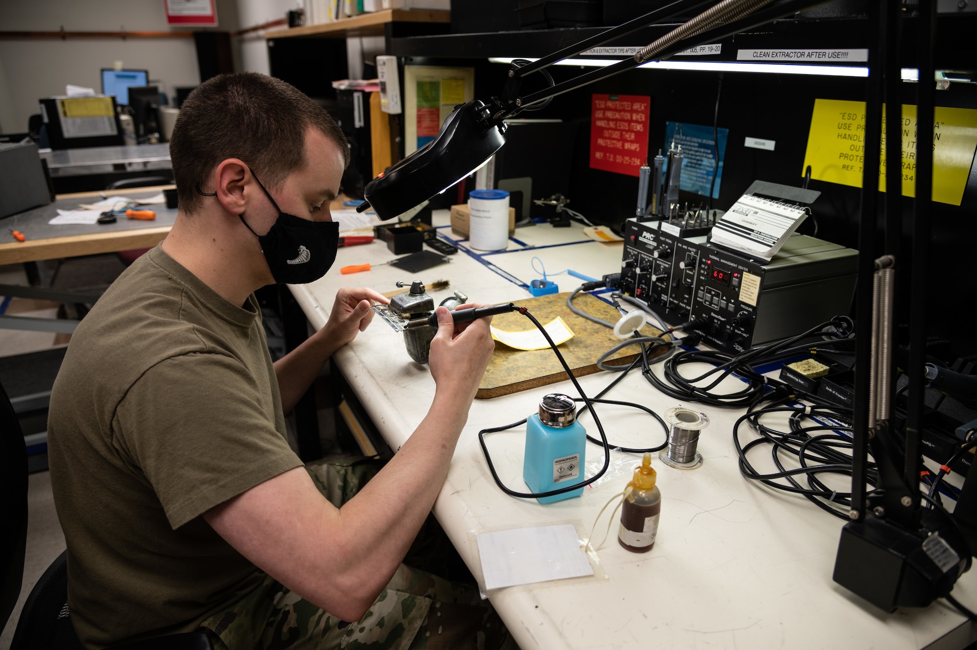 Tech. Sgt. Justin Hemsworth, 436th Maintenance Squadron avionics intermediate section chief, uses a soldering iron on a flight instrument panel at Dover Air Force Base, Delaware, May 7, 2021. Hemsworth is replacing LED lights on a public address control set panel belonging to a C-17 Globemaster III. The avionics backshop section evaluates, troubleshoots and repairs critical flight instruments found in the C-17 flight deck in order to keep Dover AFB’s fleet of C-17s ready to provide rapid global airlift.(U.S. Air Force photo by Senior Airman Marco A. Gomez)