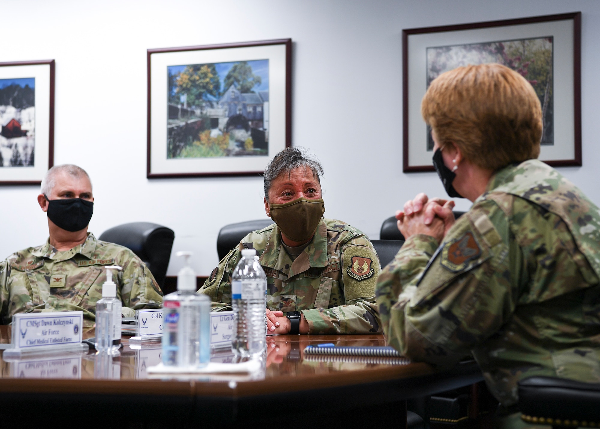 Col. Katrina Stephens, center, installation commander, speaks with Lt. Gen. Dorothy Hogg, Air Force Surgeon General, during a visit to the 66th Medical Squadron clinic at Hanscom Air Force Base, Mass., May 11., as Col. Mark Oordt, 66 MDS commander, looks on. Hogg visited Hanscom medics to recognize and highlight their work throughout COVID-19. (U.S. Air Force photo by Lauren Russell)