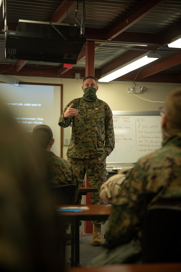 Col. Patrick Tiernan, Deputy Group Commander, Marine Aircraft Group 41, 4th Marine Aircraft Wing, explains the importance of Chemical, Biological, Radiological, and Nuclear (CBRN) individual safety measures during Arctic Care 2021, Kodiak, Alaska, on May 7, 2021. Arctic Care 2021 is a joint-service training mission led by the United States Air Force and supported by members of the Air National Guard, Marines, Marine Reserves, Navy, Navy Reserves, National Guard, and Army Reserves. (U.S. Marine Corps photo by Lance Cpl. James Stanfield)