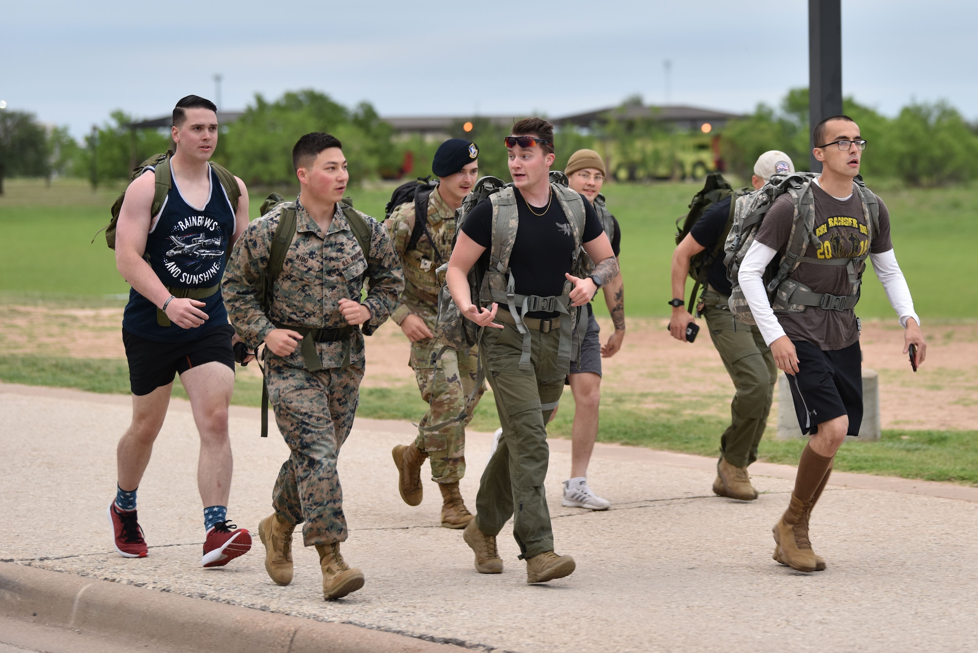 Goodfellow members jog during a ruck around Goodfellow Air Force Base, Texas, in honor of National Police Week, May 10, 2021. The ruck was approximately four miles and followed the perimeter of the base. (U.S. Air Force photo by Staff Sgt. Seraiah Wolf)