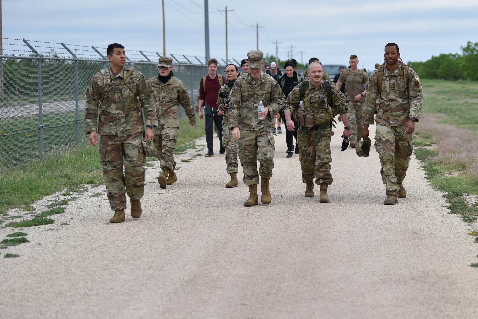 Goodfellow members finish the last portion of a ruck during National Police Week on Goodfellow Air Force Base, Texas, May 10, 2021. After the ruck a pancake breakfast was held for all of the participants. (U.S. Air Force photo by Staff Sgt. Seraiah Wolf)
