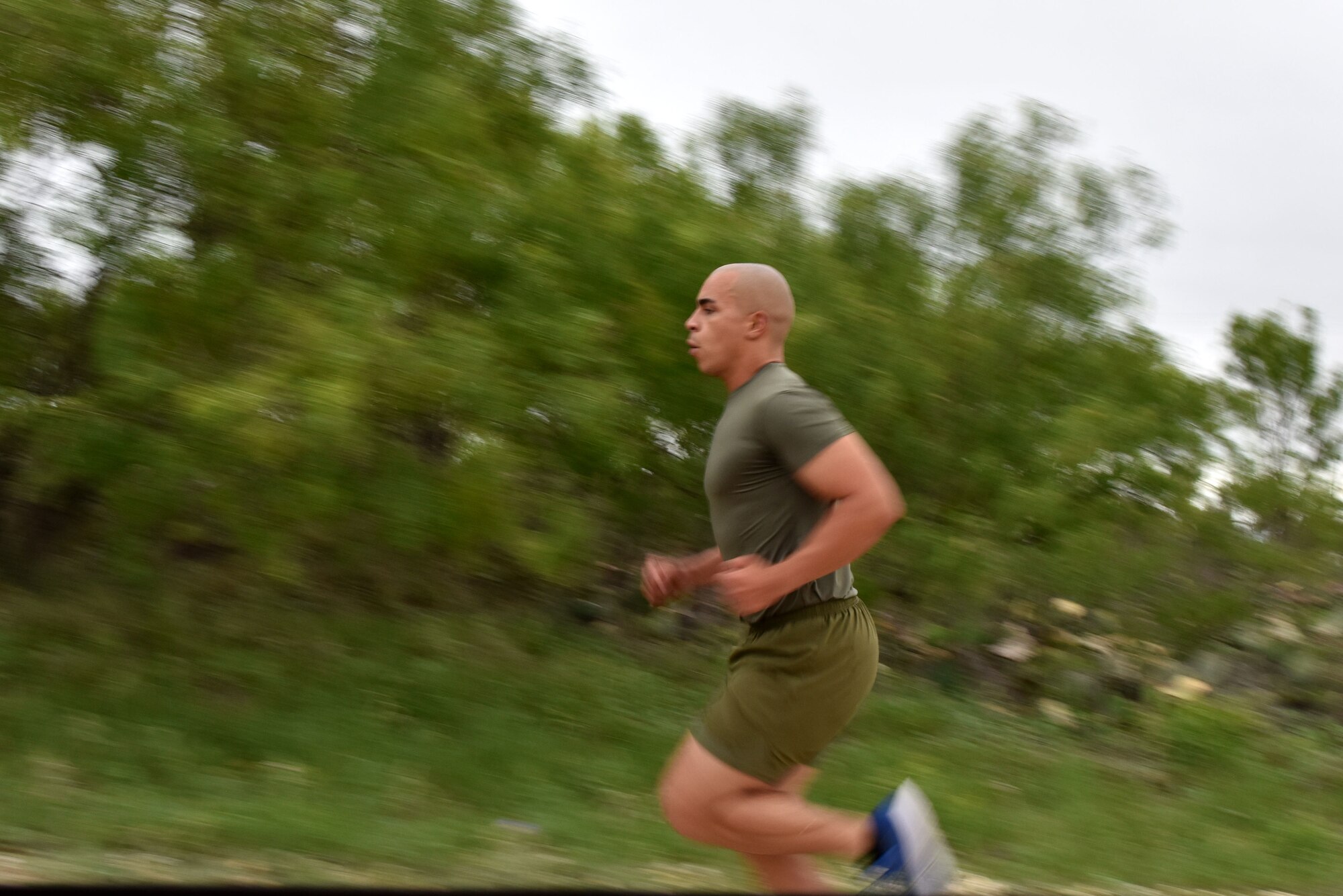 A Goodfellow member runs to the next challenge during the run and obstacle course on Goodfellow Air Force Base, Texas, May 12, 2021. The event was held in honor of National Police Week where members could walk, jog or run from one challenge to the next. (U.S. Air Force photo by Staff Sgt. Seraiah Wolf)