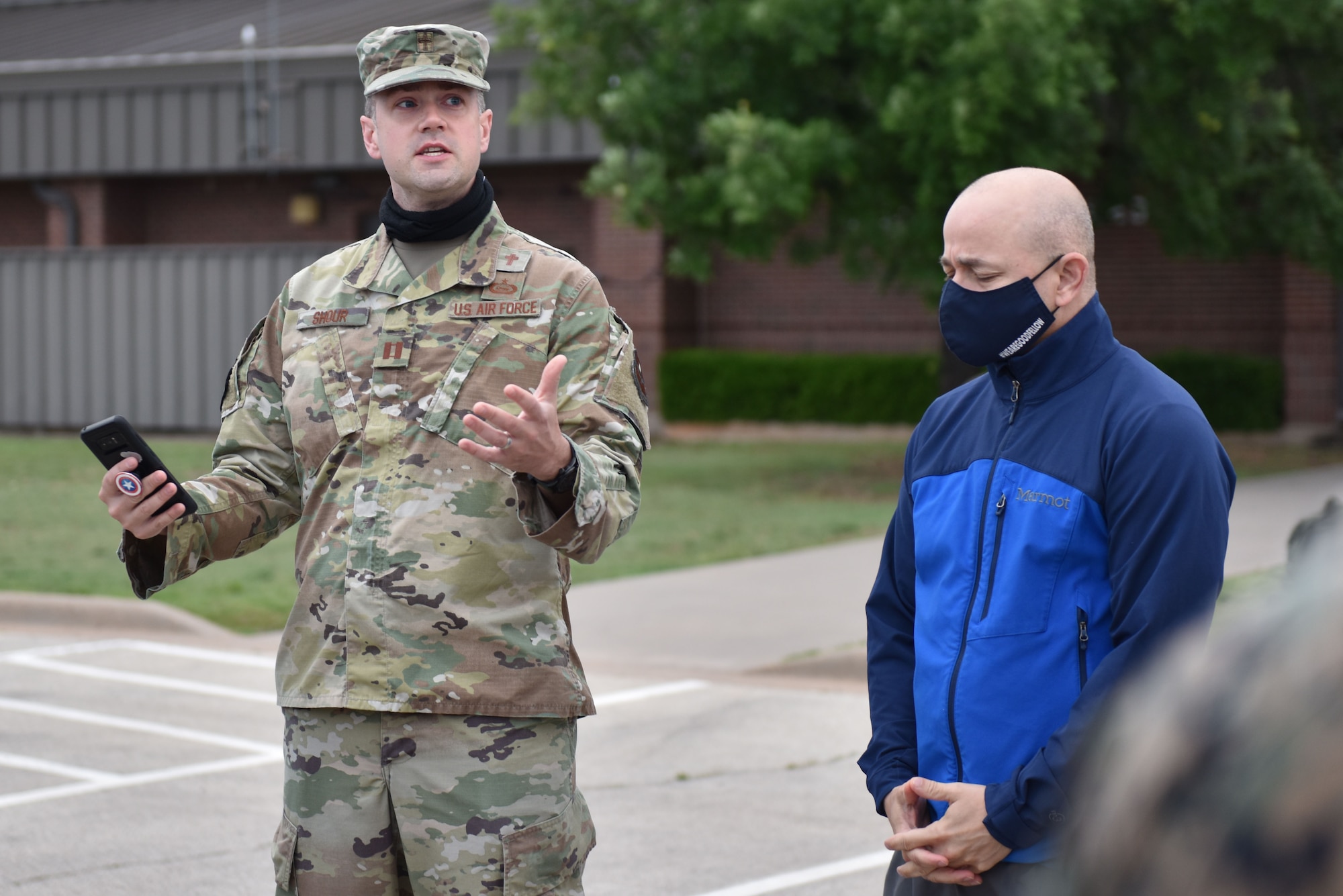 U.S. Air Force Capt. Jonathan Shour, 17th Training Wing chaplain, leads a group of members in prayer before the beginning of a ruck in honor of National Police Week on Goodfellow Air Force Base, Texas, May 10, 2021. After the prayer a security forces member read the defender’s prayer. (U.S. Air Force photo by Staff Sgt. Seraiah Wolf)