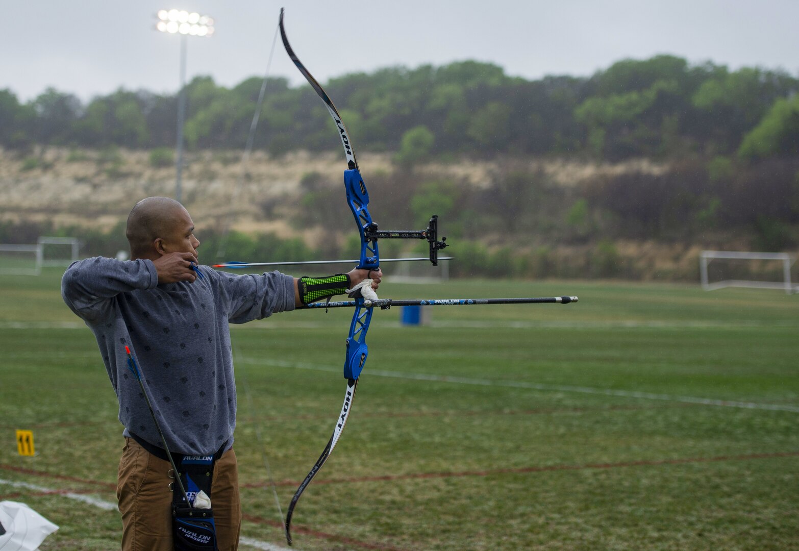 Man shooting arrow.