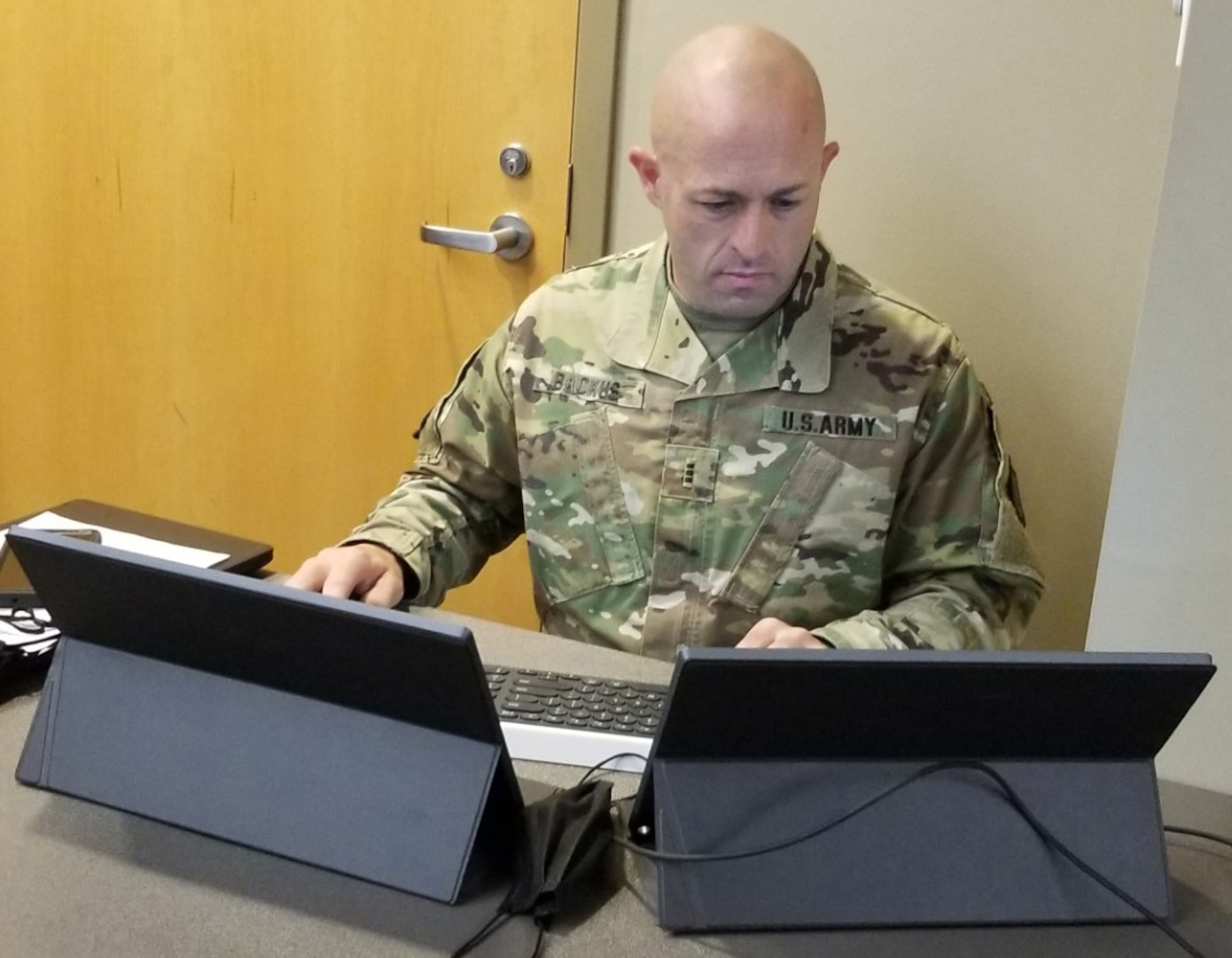 Army Chief Warrant Officer 3 Gregory Backus, an information protection technician with the Army National Guard’s Professional Education Center, initiates a cyberattack on the computer networks of students participating in Interactive War Games, a cyber awareness event at Arkansas State University-Beebe, April 28, 2021. Backus was showing students what a cyberattack looked like as they were participating in simulated battlefield drills from laptop computers.