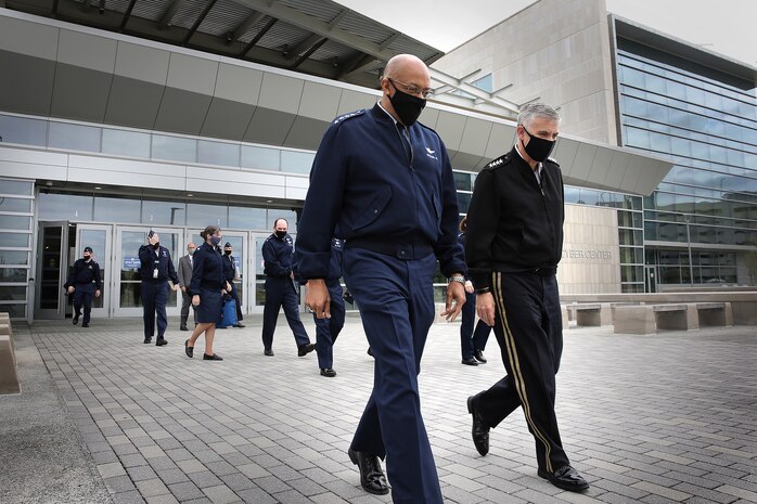 Gen. Charles Q. Brown, Jr., Chief of Staff of the Air Force, walks beside Gen. Paul M. Nakasone, U.S. Cyber Command commander and National Security Agency director, during his visit to USCYBERCOM, at Fort George G. Meade, Md., May 10, 2021.