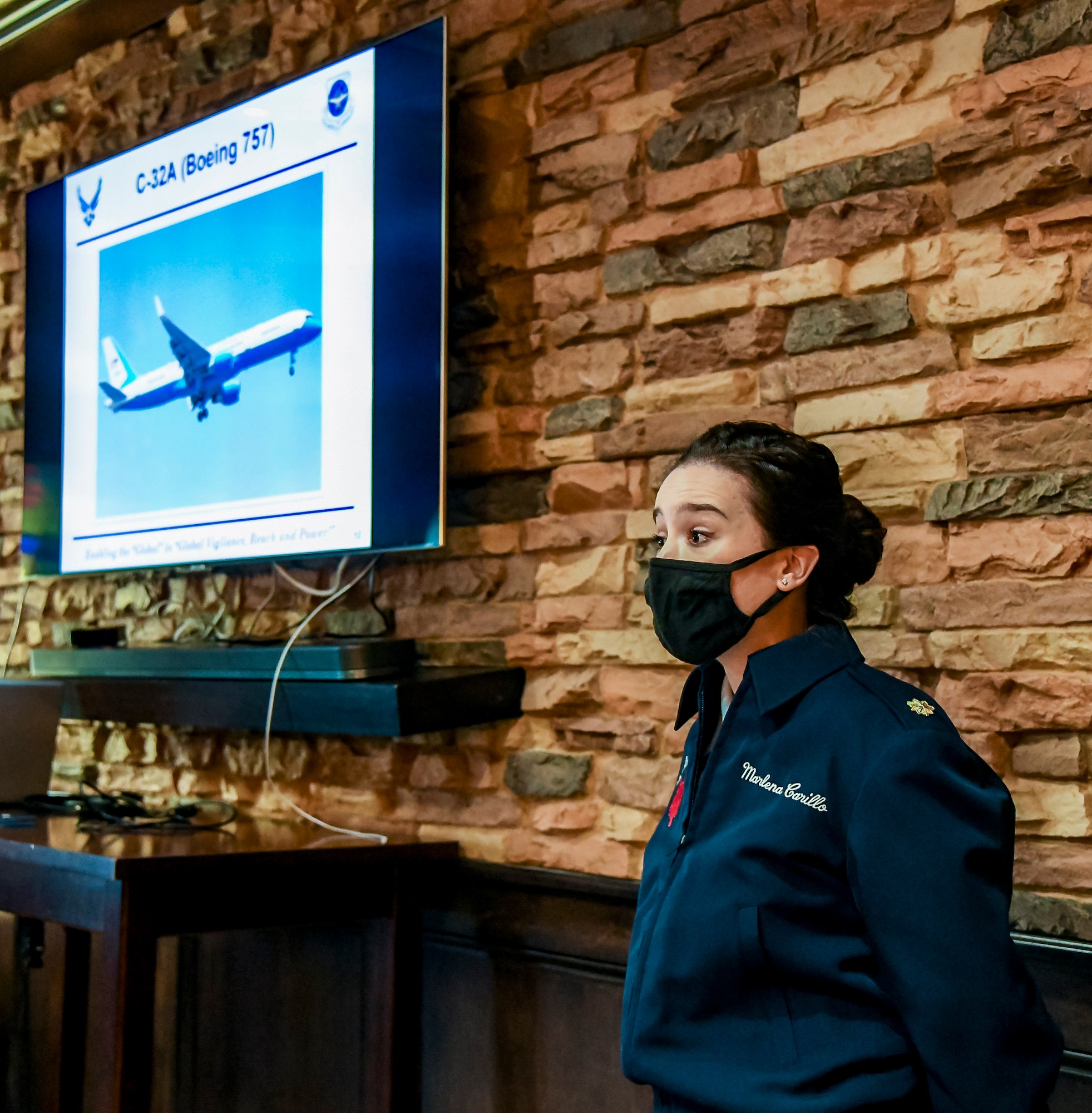 Maj. Marlena Carrillo, 1st Airlift Squadron pilot, briefs visiting Dover Air Force Base honorary commanders on the 89th Airlift Wing mission at Joint Base Andrews, Md., May 10, 2021. The 89th AW provides global Special Air Mission airlift, logistics, aerial port and communications for the president, vice president, Cabinet members, combatant commanders and other senior military and elected leaders as tasked by the White House, Air Force Chief of Staff and Air Mobility Command. (U.S. Air Force photo by Airman 1st Class Stephani Barge)