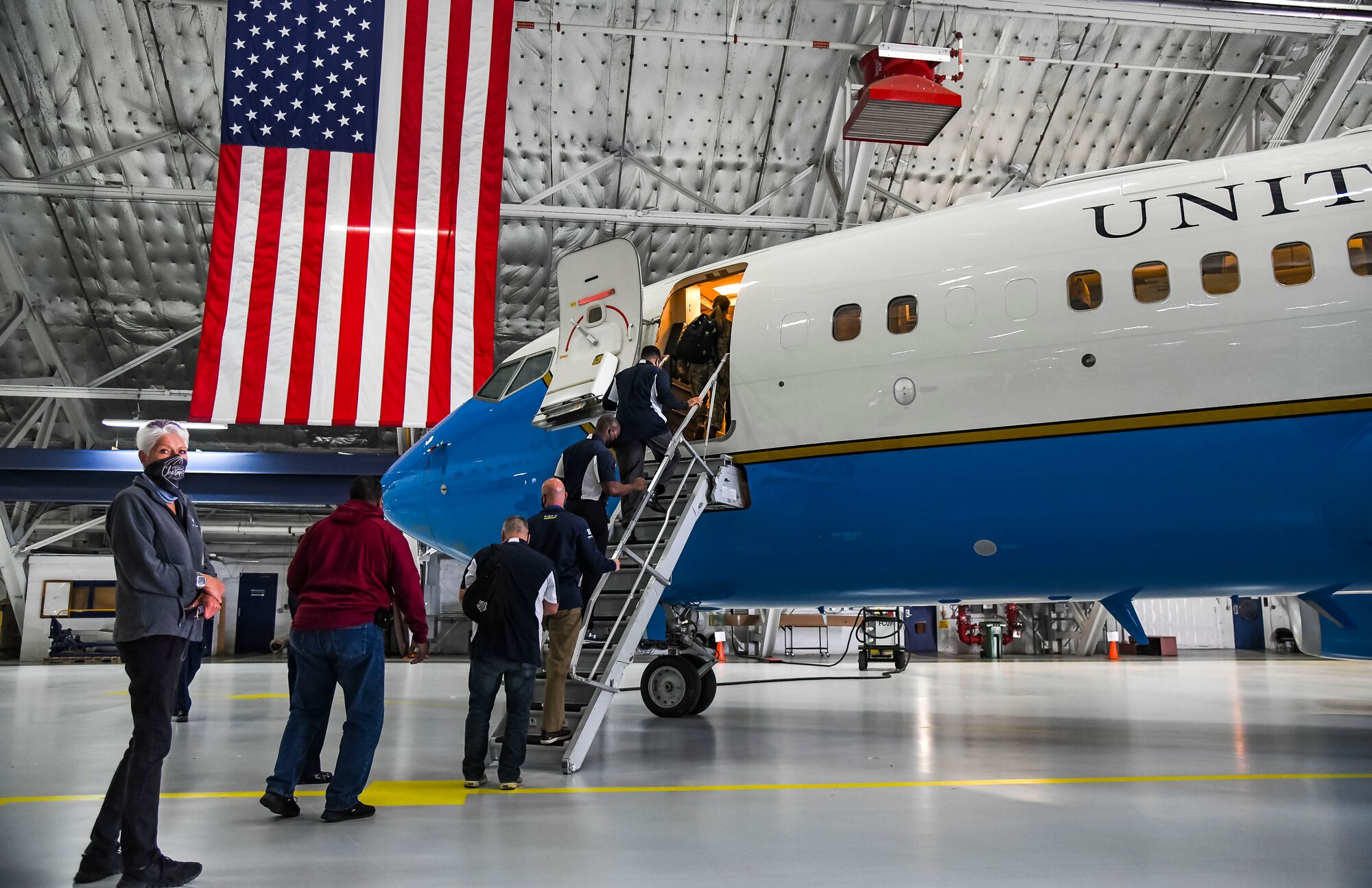 Dawne Nickerson, 436th Airlift Wing community engagement chief, and Dover Air Force Base honorary commanders tour a C-32A aircraft at Joint Base Andrews, Maryland, May 10, 2021. The C-32A provides safe, comfortable and reliable transportation for U.S. leaders to locations around the world. The primary customers are the vice president, the first lady and members of the Cabinet and Congress. (U.S. Air Force photo by Airman 1st Class Stephani Barge)
