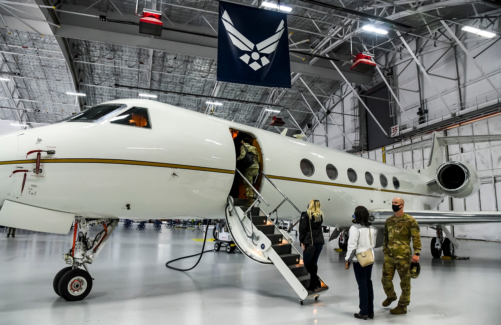 Dover Air Force Base honorary commanders tour a C-37B from the 99th Airlift Squadron during a visit to Joint Base Andrews, Maryland, May 10, 2021. The C-37B is a twin-engine, turbofan aircraft acquired to fill the worldwide special airlift missions for high ranking government and Department of Defense officials. (U.S. Air Force photo by Airman 1st Class Stephani Barge)