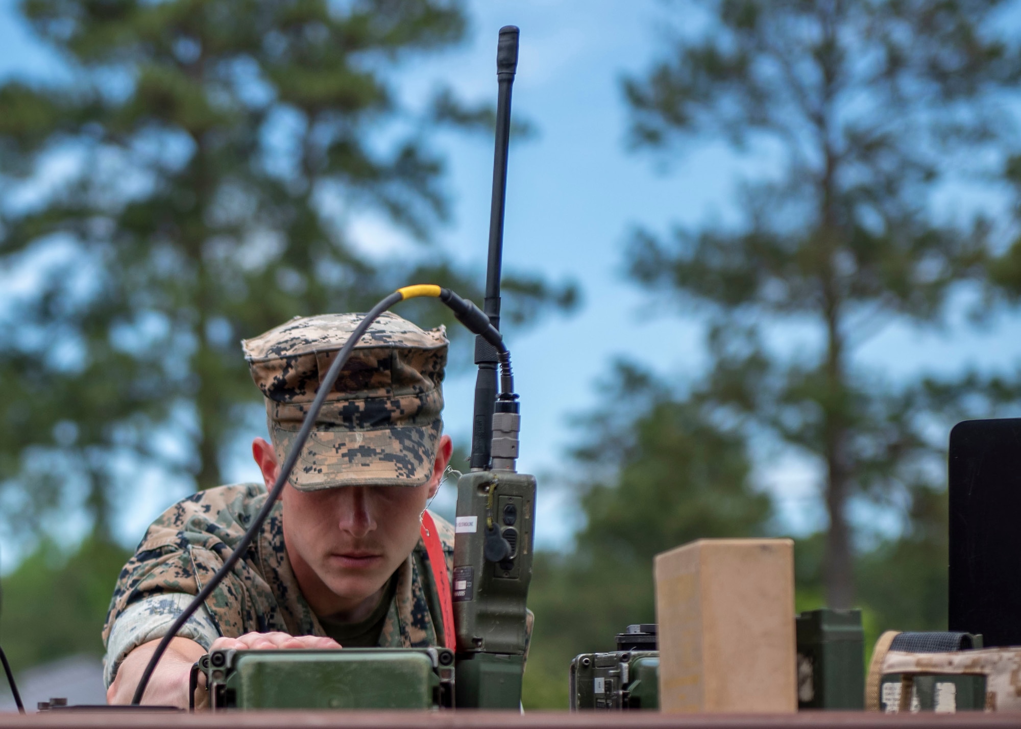 Cpl. David Hedges, field radio operators with Headquarters Battalion Company 2nd Marine Division, inspects the radio configurations on a PRC-117G radio set at Seymour Johnson Air Force Base, North Carolina, May 5, 2021.