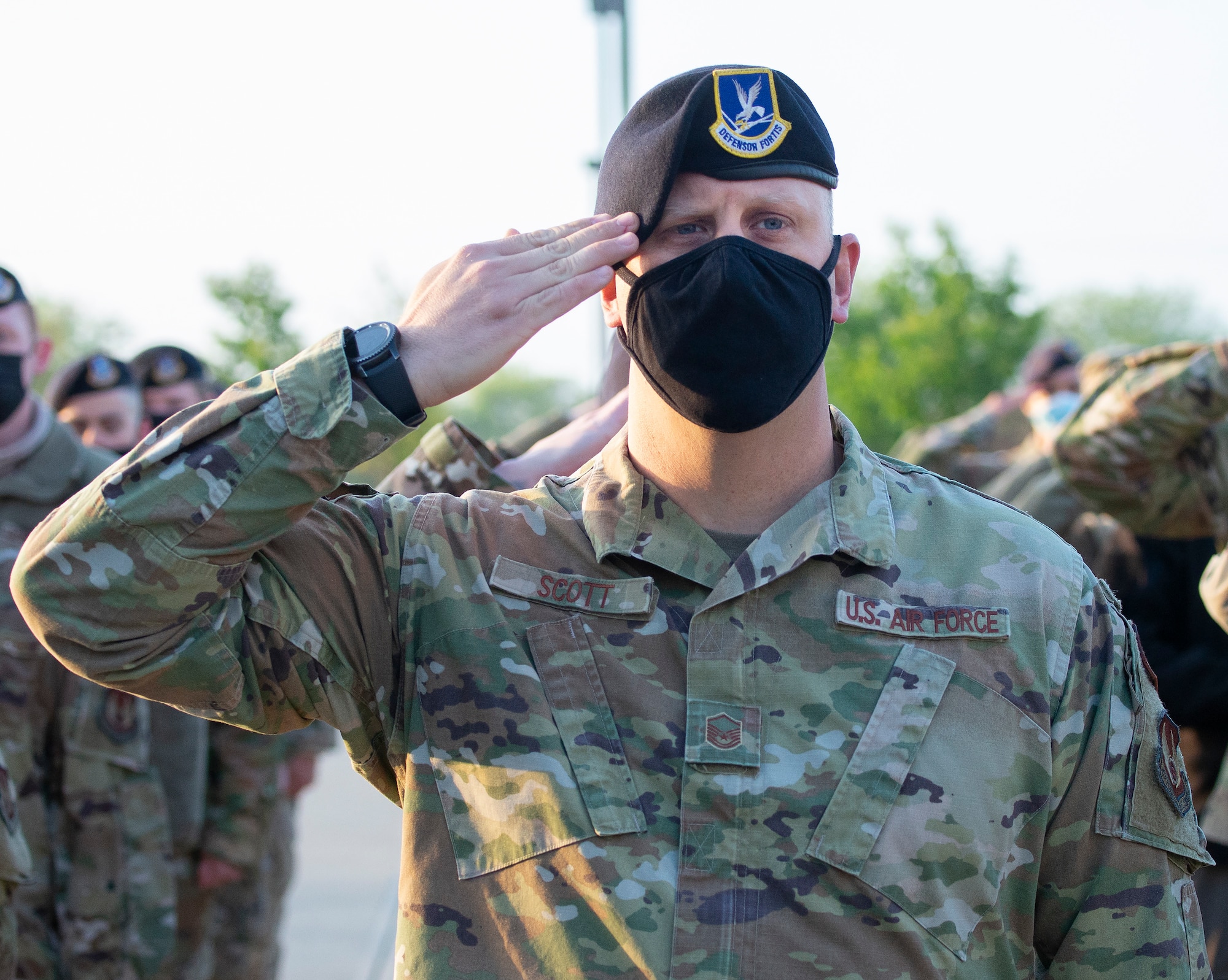Air Force Master Sgt. David Scott, 88th Security Forces Squadron, salutes during the national anthem at a ceremony prior to his squadron’s annual ruck march May 10 at Wright-Patterson Air Force Base, Ohio. The event marked the beginning of the Police Week activities. (U.S. Air Force photo by R.J. Oriez)